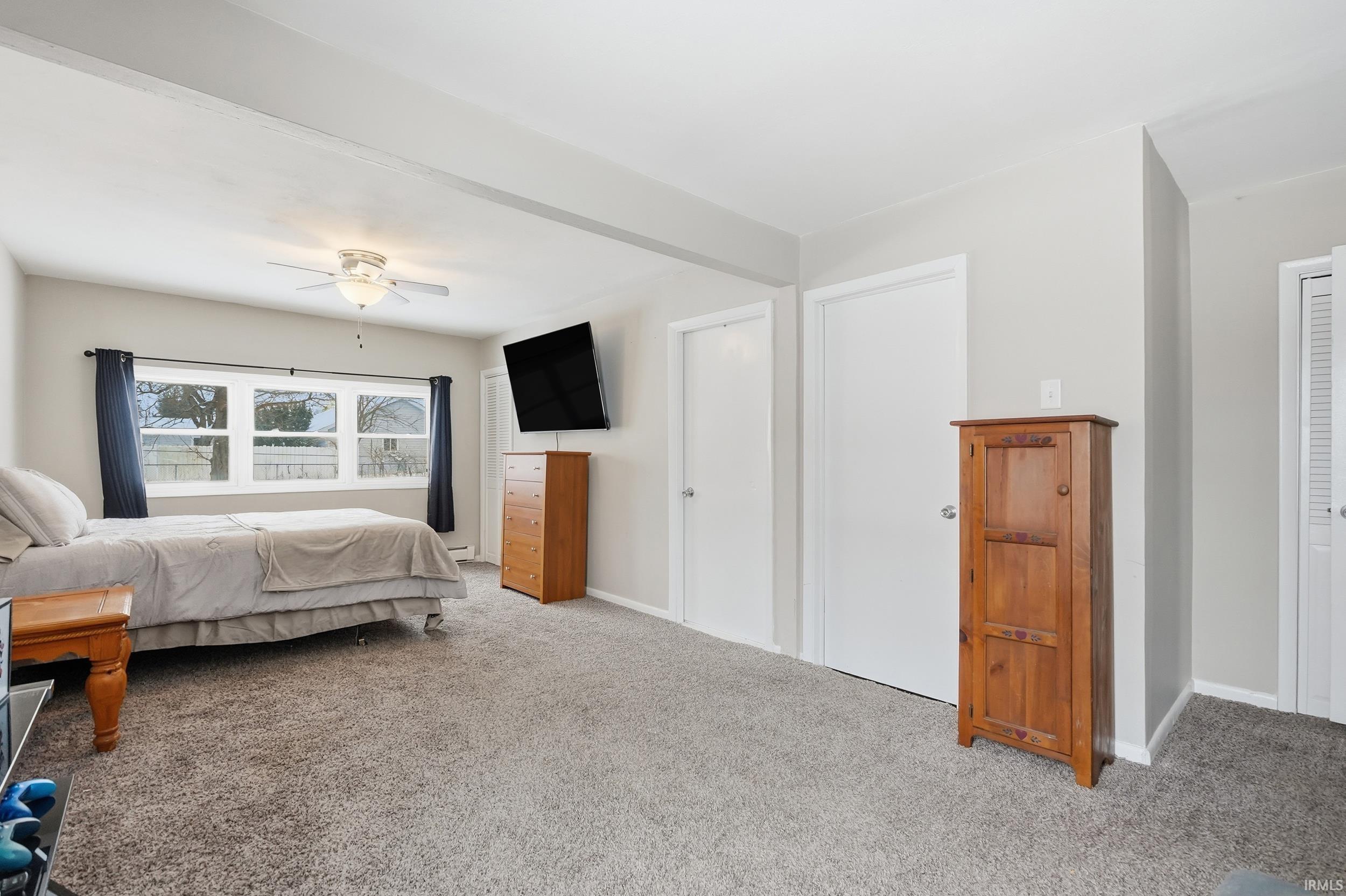 Bedroom featuring carpet floors and ceiling fan