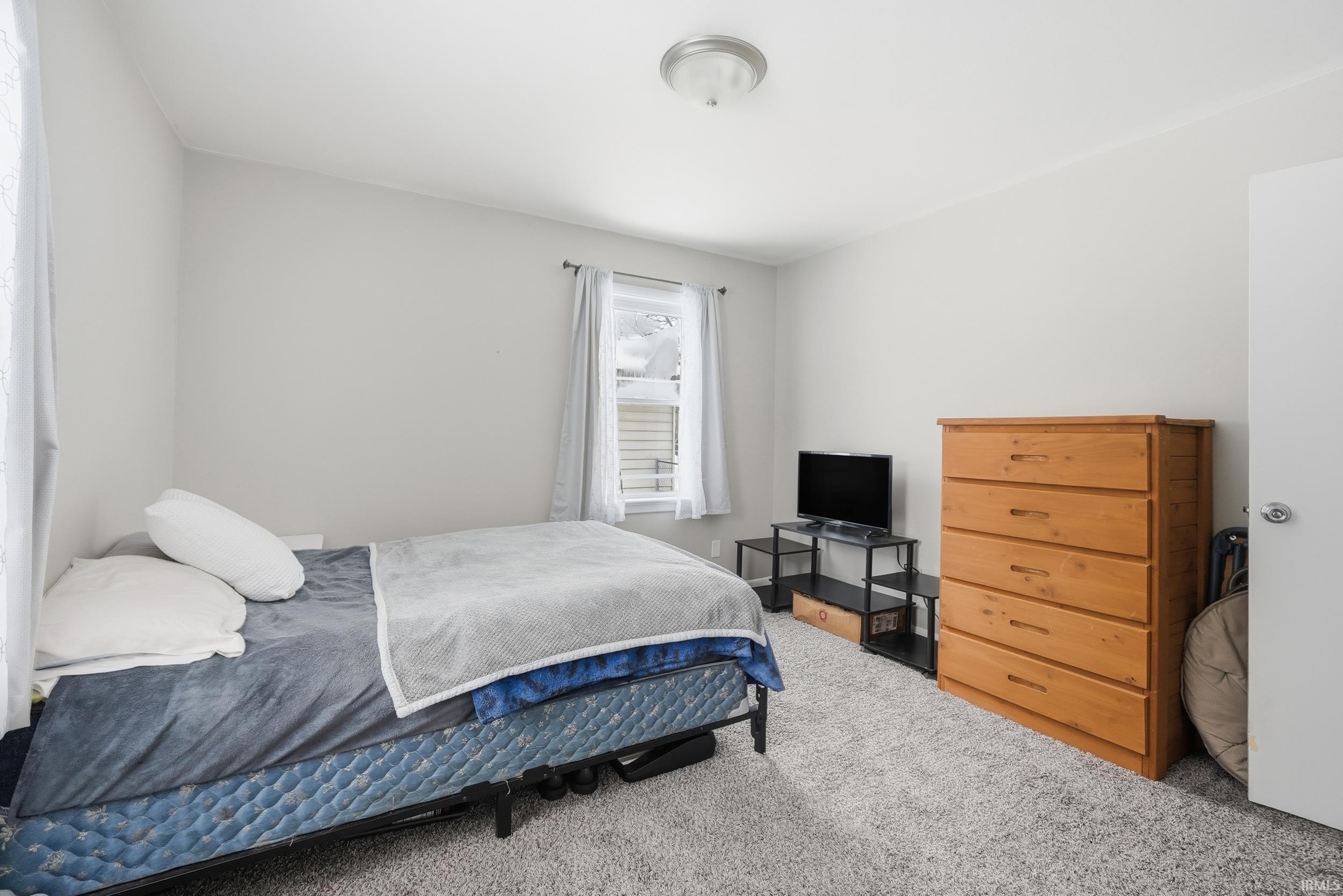 Bedroom featuring carpet