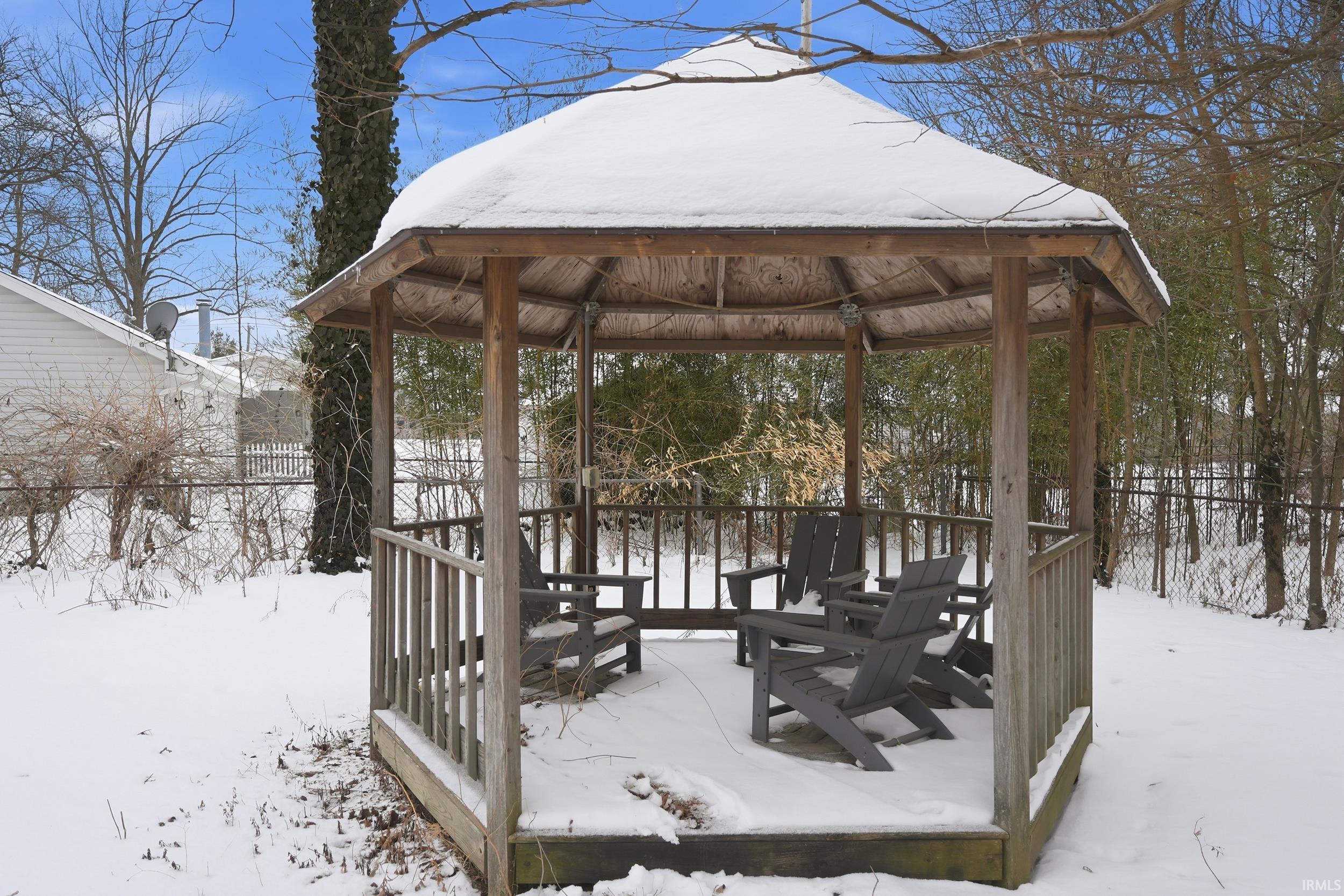 View of property's community featuring a gazebo and a deck