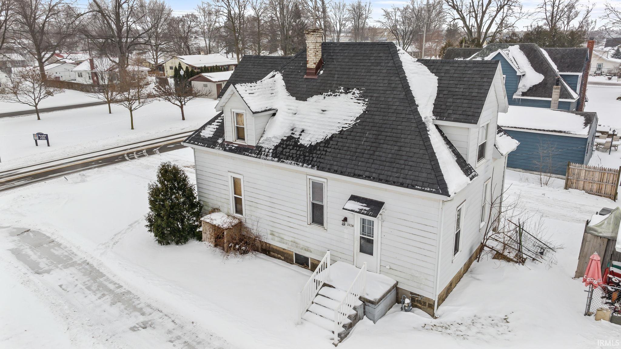 Snowy aerial view with a residential view