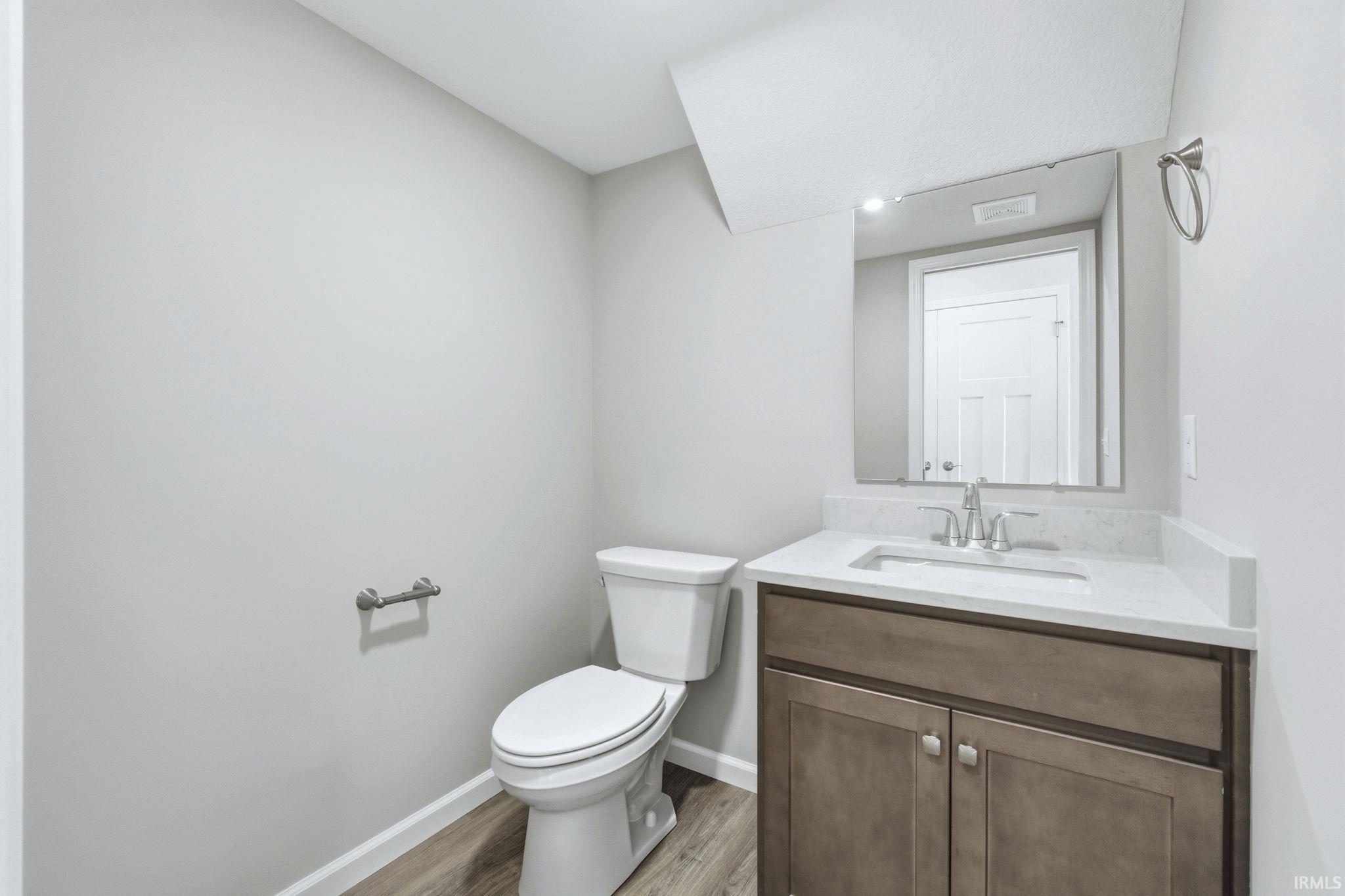 Bathroom with vanity and light wood-type flooring