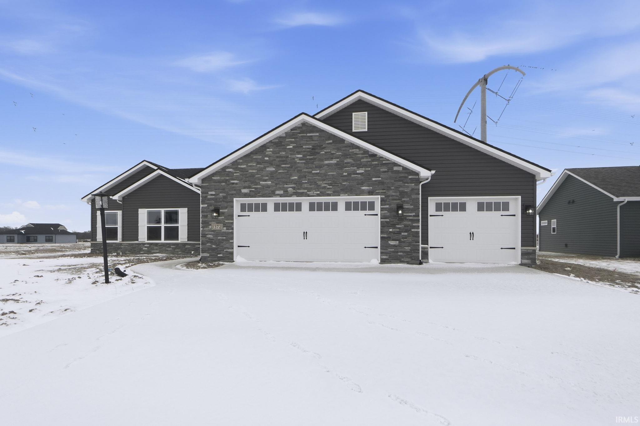 Craftsman-style home with a garage