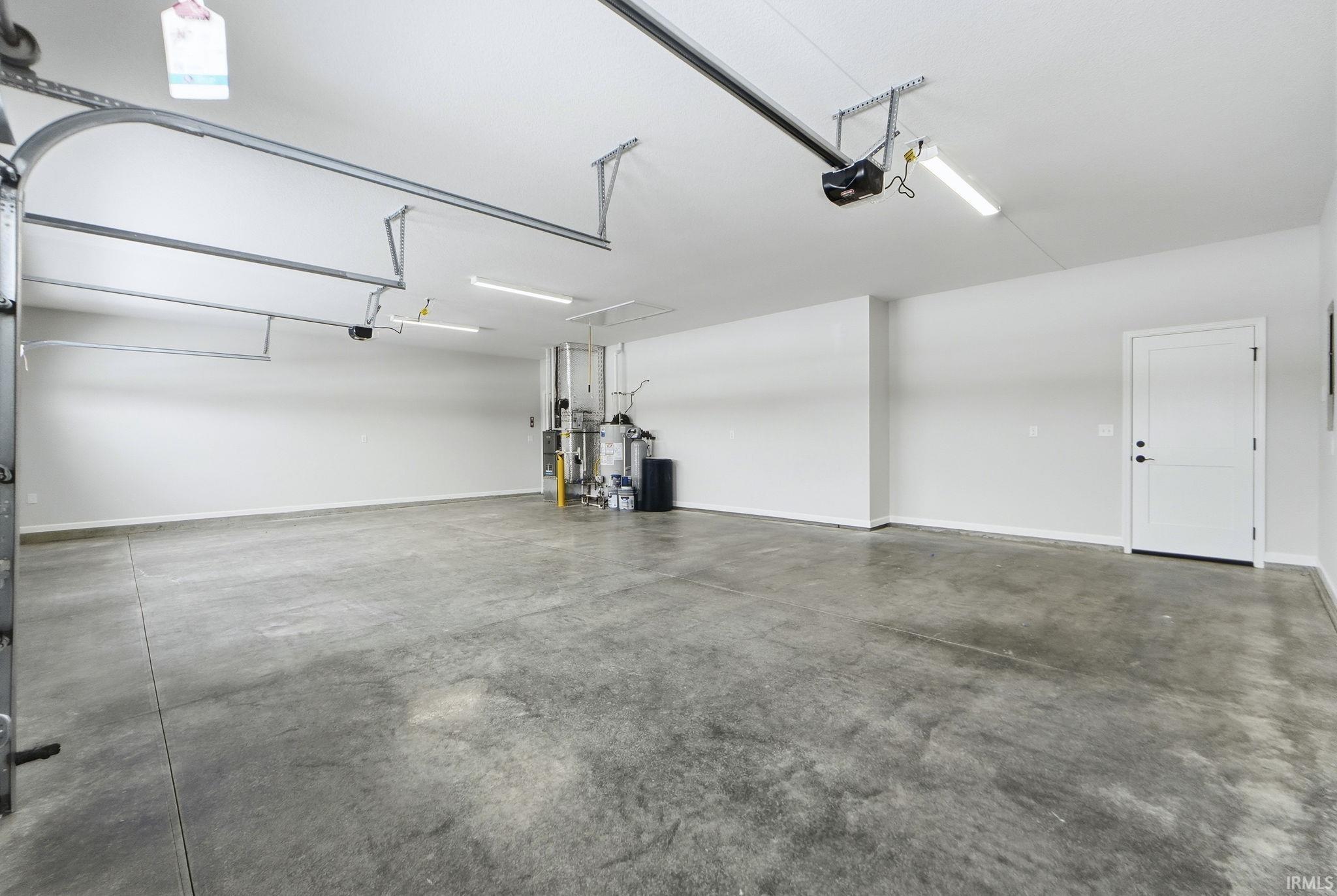 Garage featuring baseboards