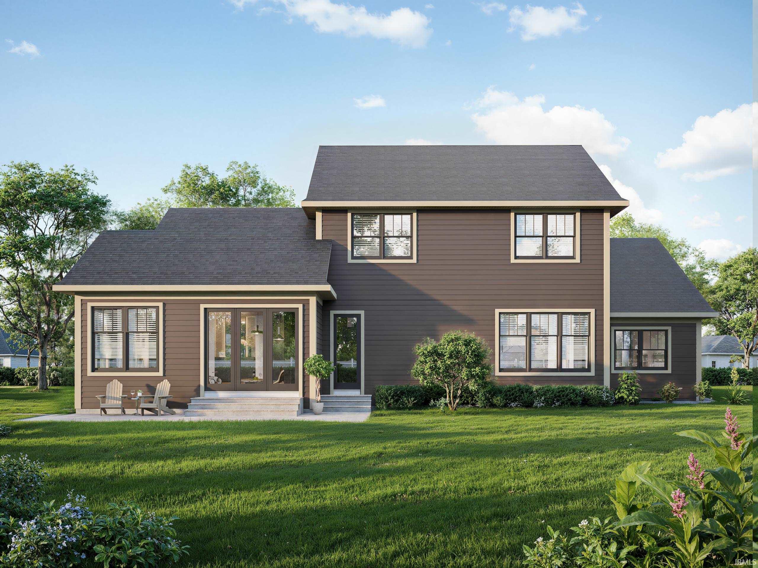 Rear view of house with a lawn, a patio area, and french doors