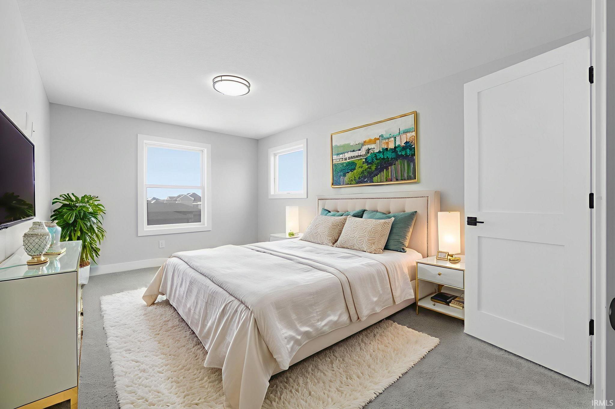 Carpeted bedroom featuring baseboards