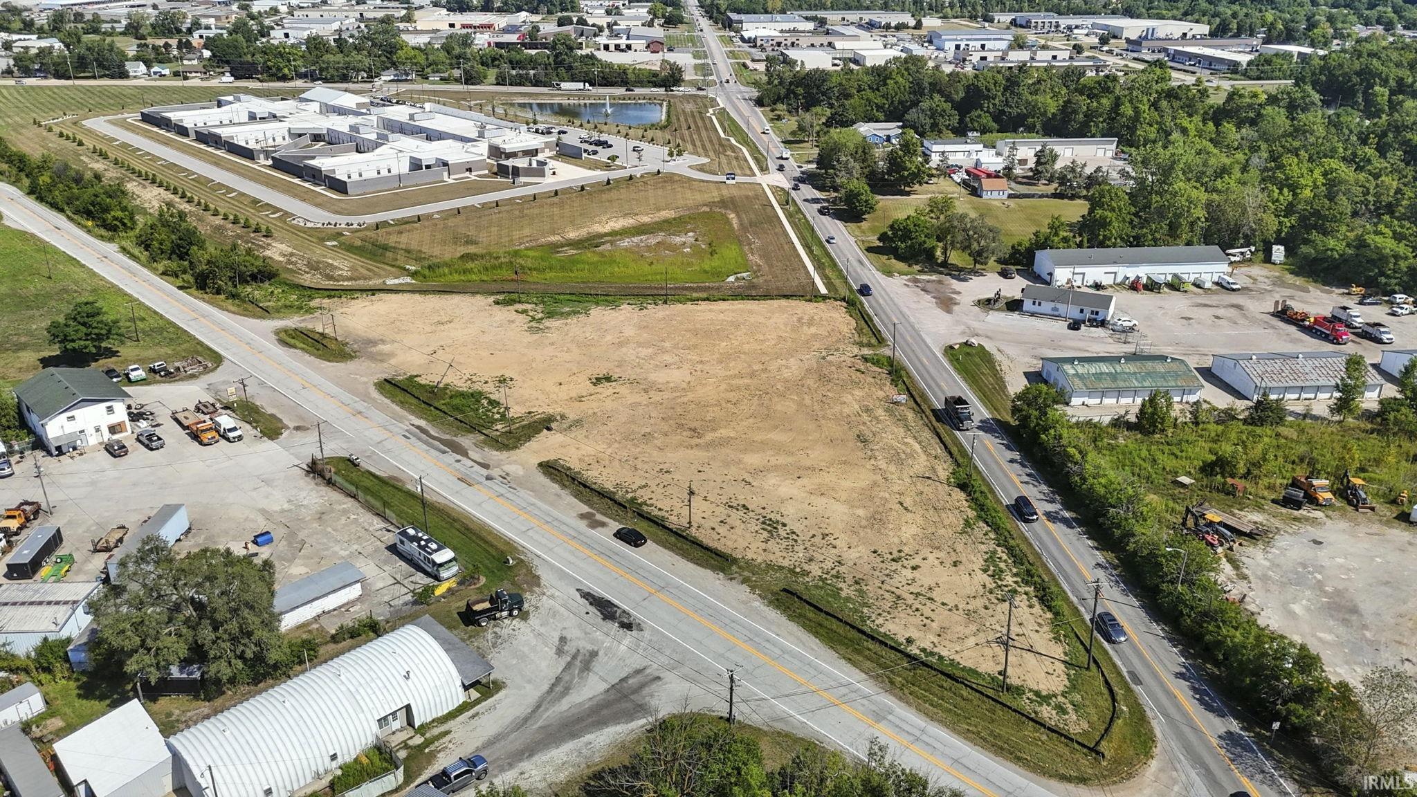 Aerial view of property's location featuring a large body of water