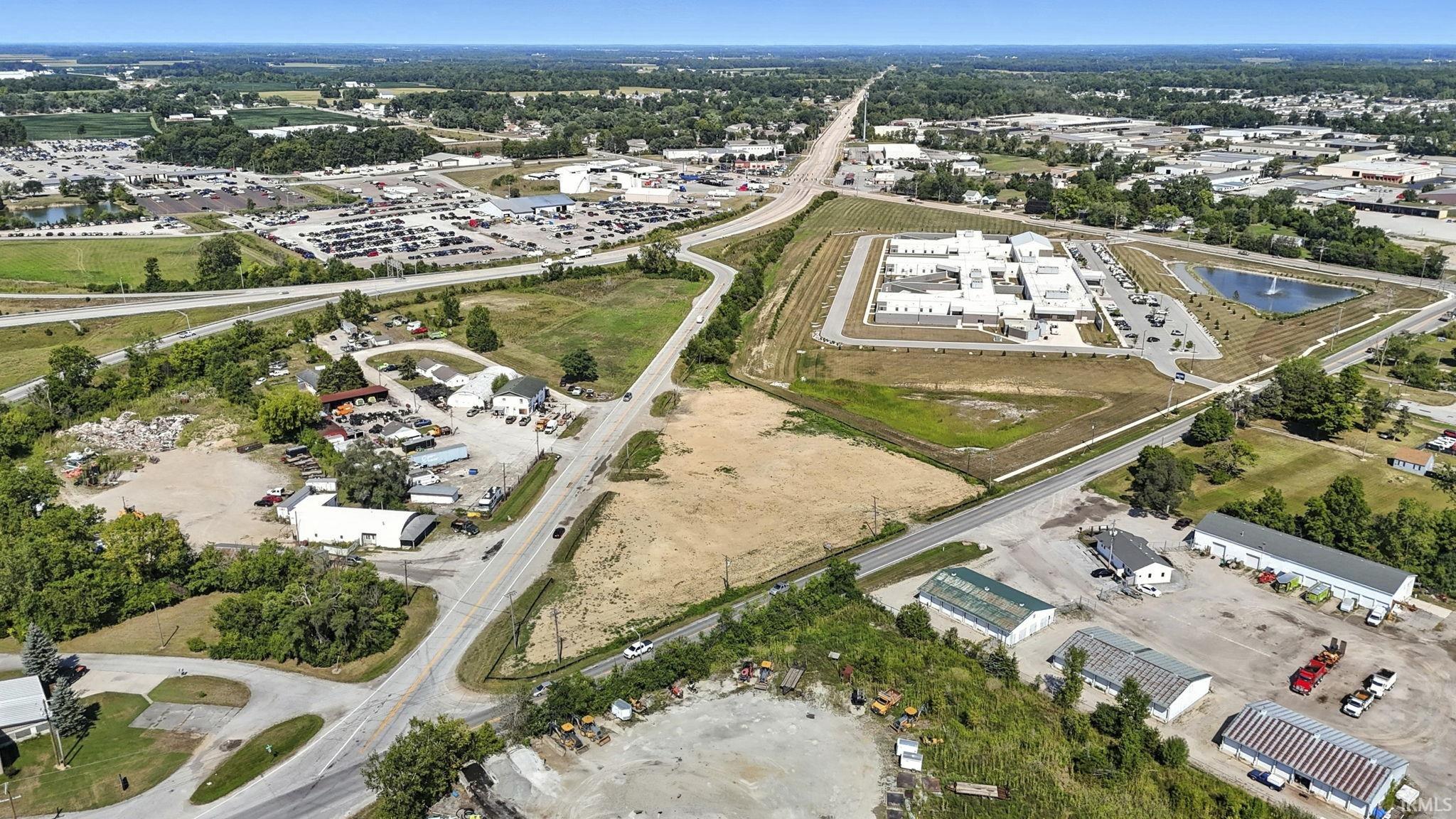 Aerial overview of property's location featuring a nearby body of water