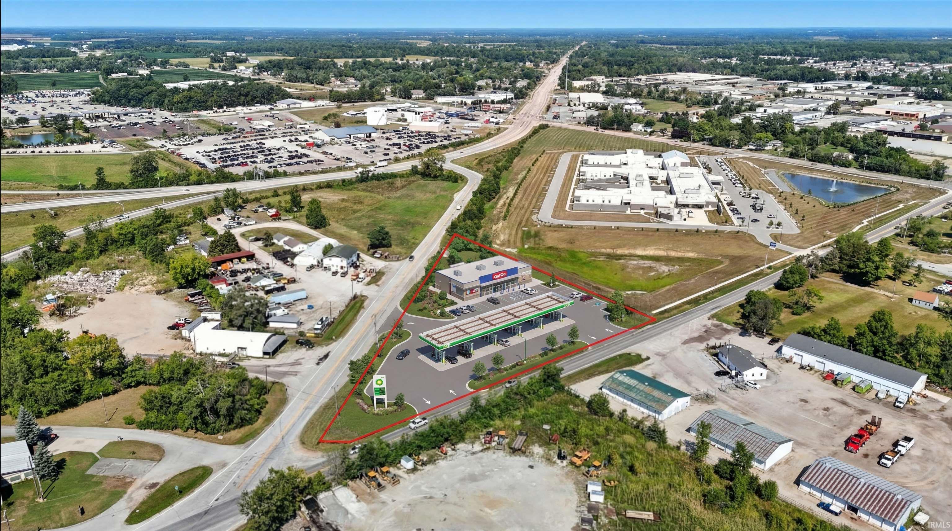 Aerial view of property's location featuring property parcel outlined and a large body of water