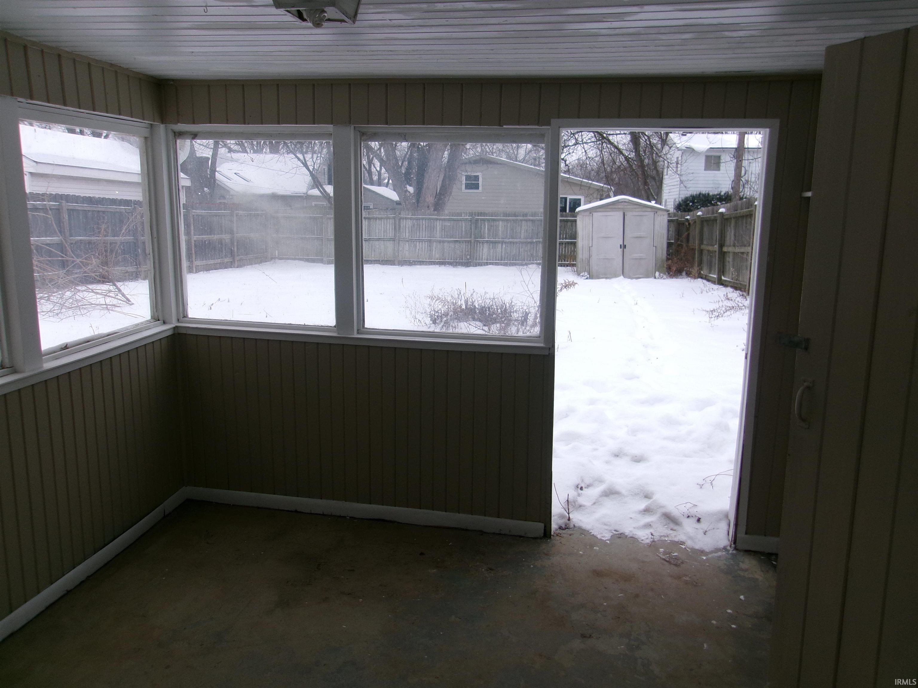 Unfurnished sunroom with healthy amount of natural light