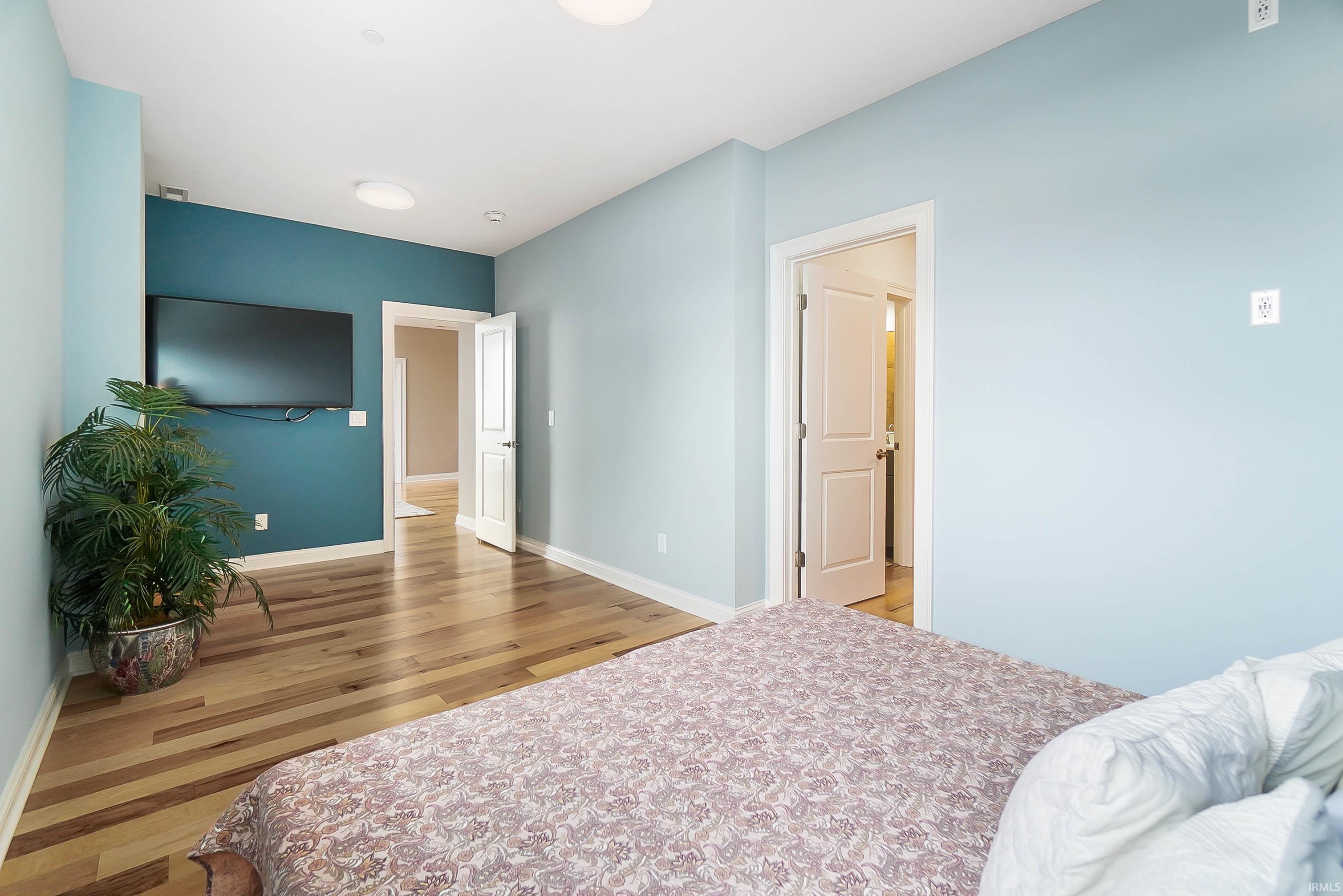 Bedroom featuring baseboards and light wood-style floors