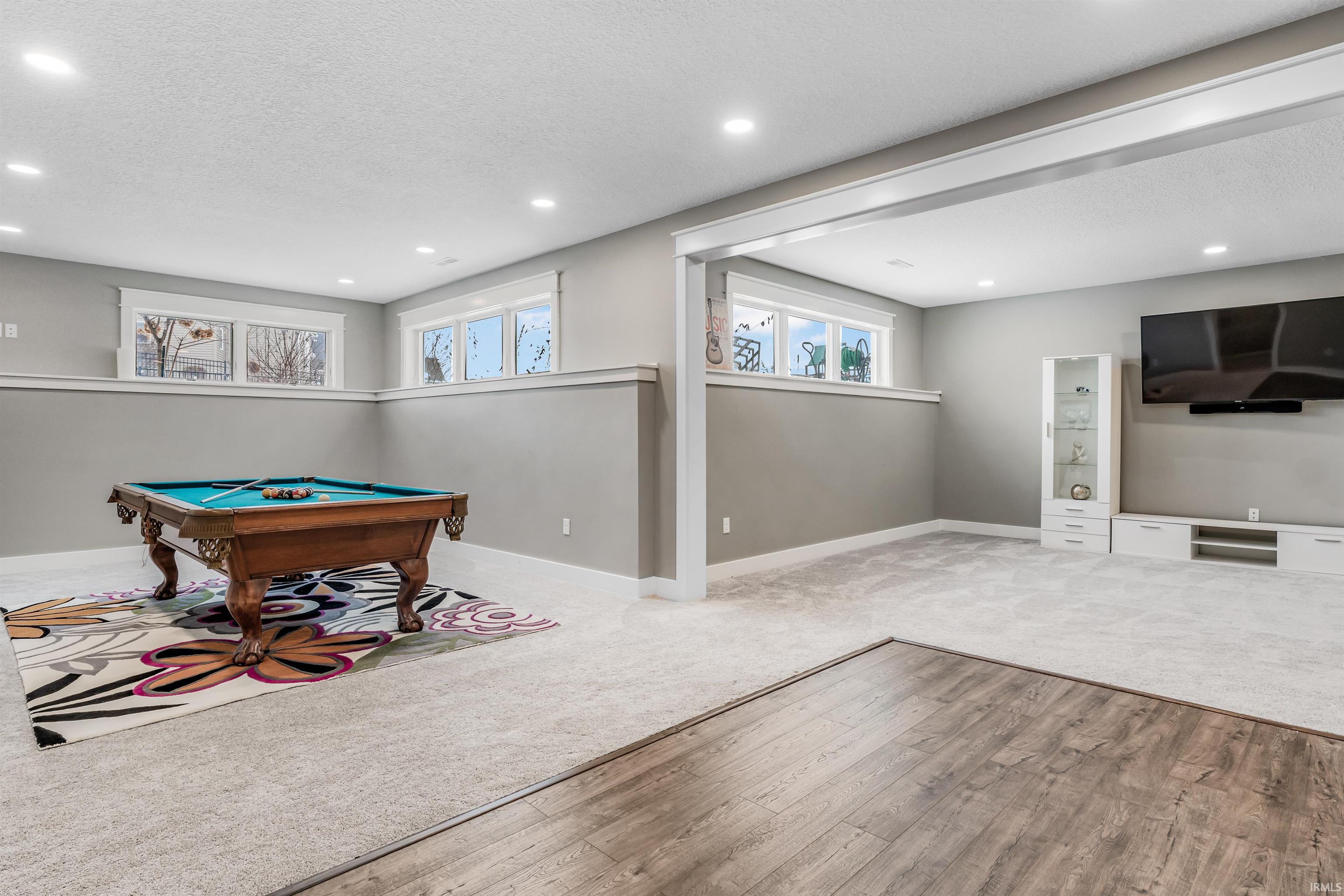 Game room with billiards, wood-type flooring, carpet, recessed lighting, and a textured ceiling