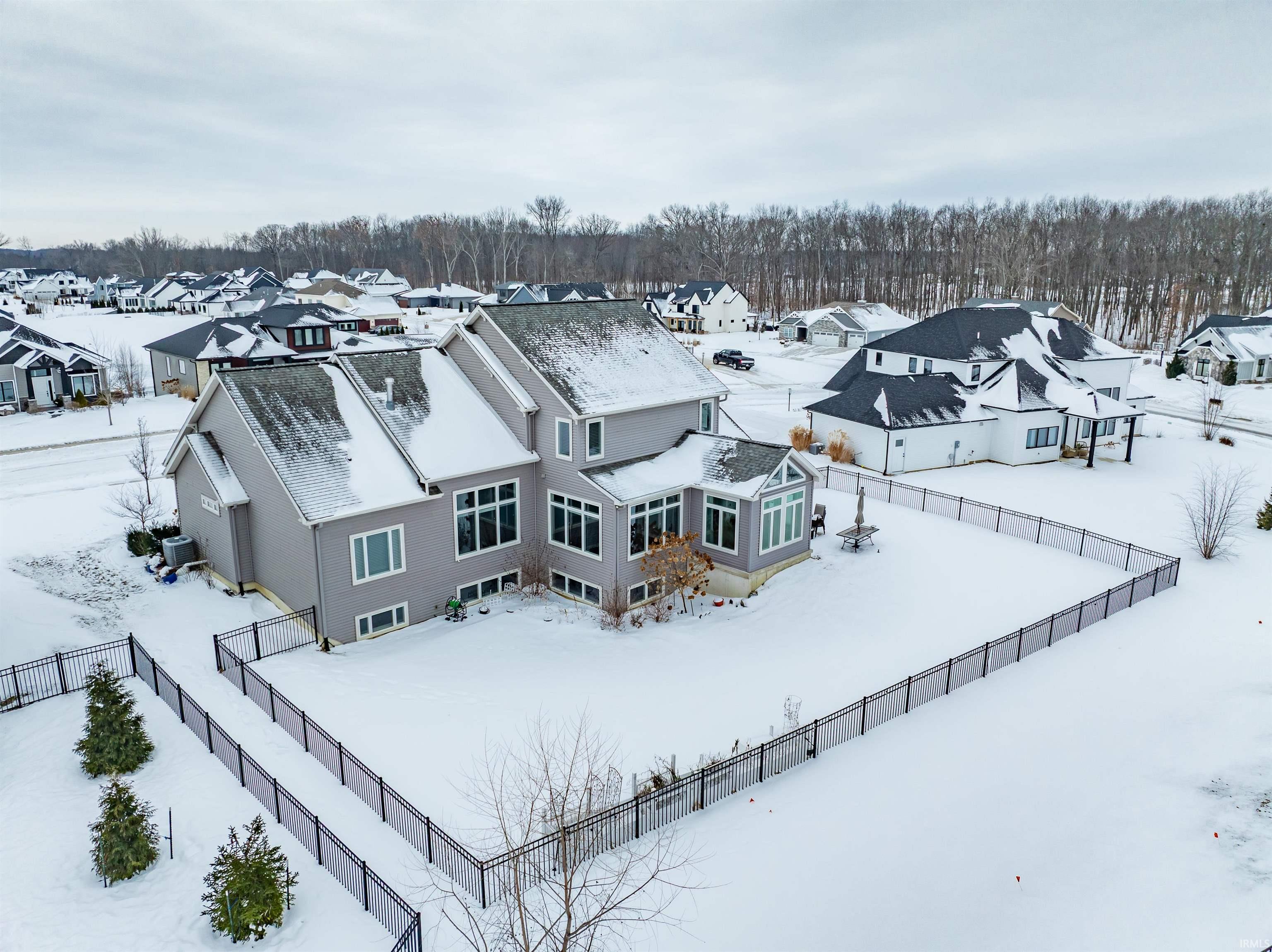 Snowy aerial view with a residential view
