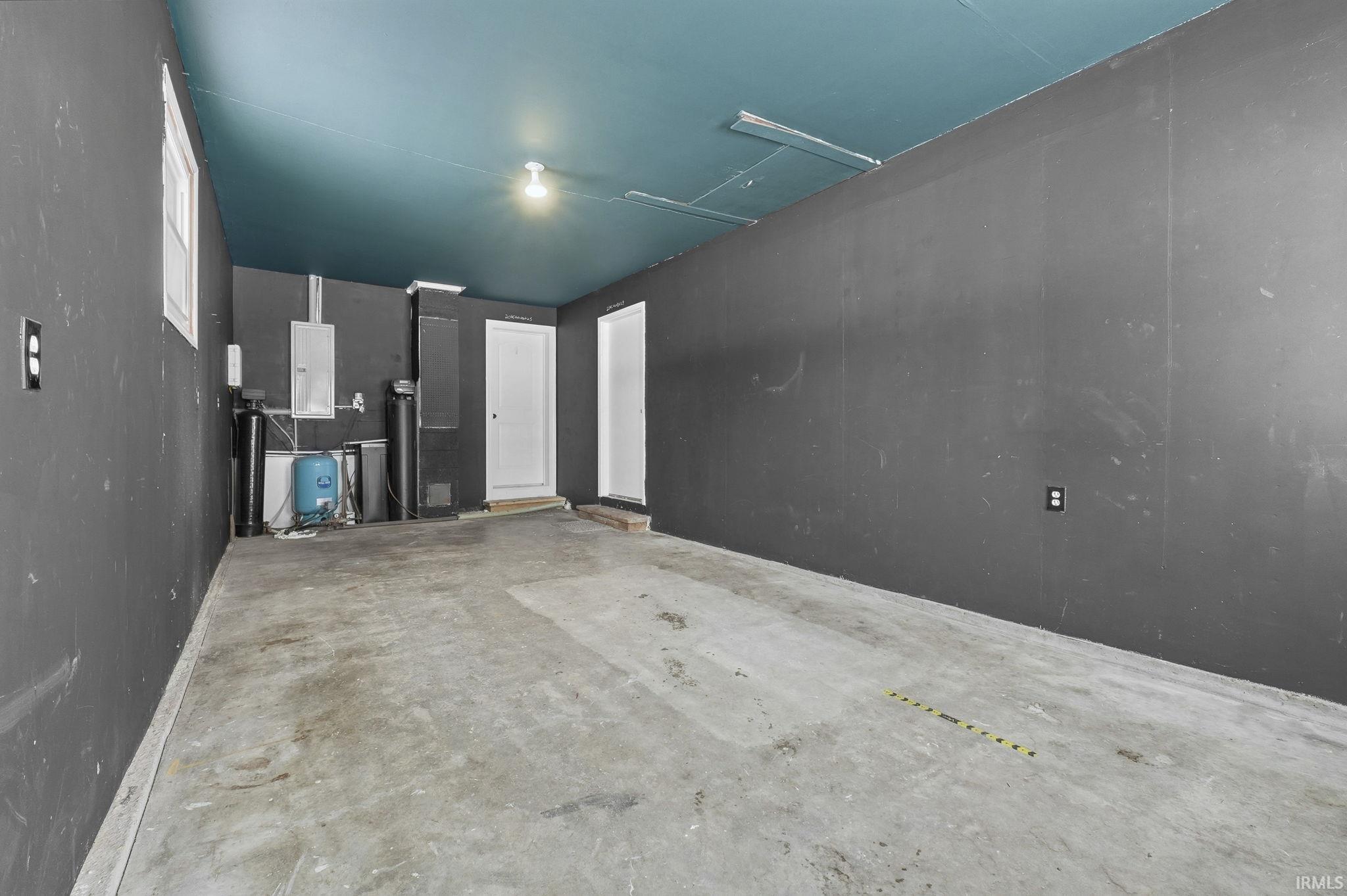 Garage featuring electric panel