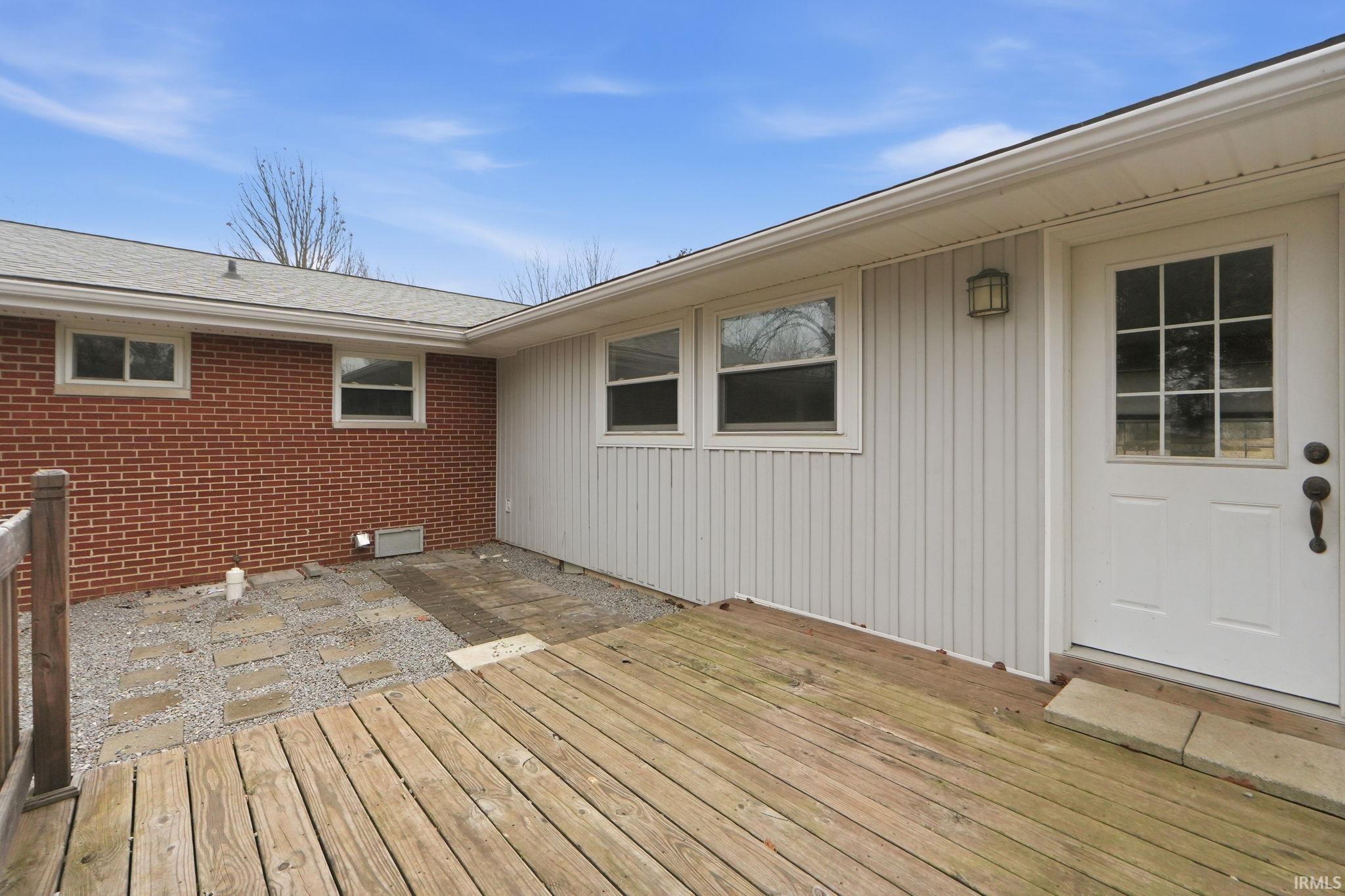 Wooden deck featuring a patio area