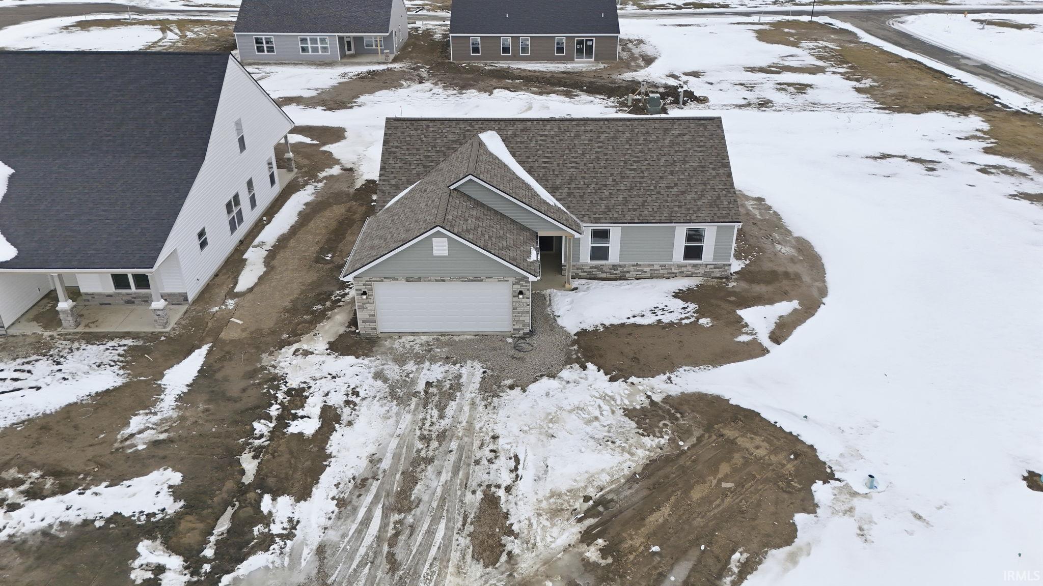 Snowy aerial view with a residential view