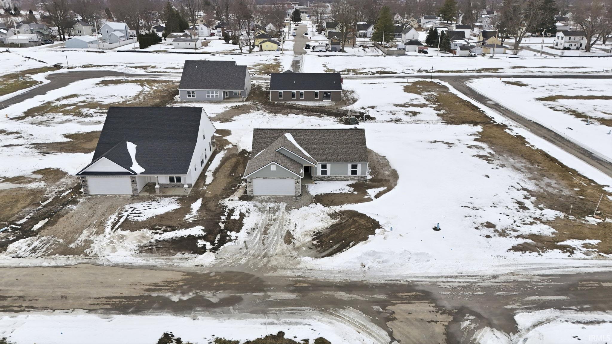 Snowy aerial view featuring a residential view