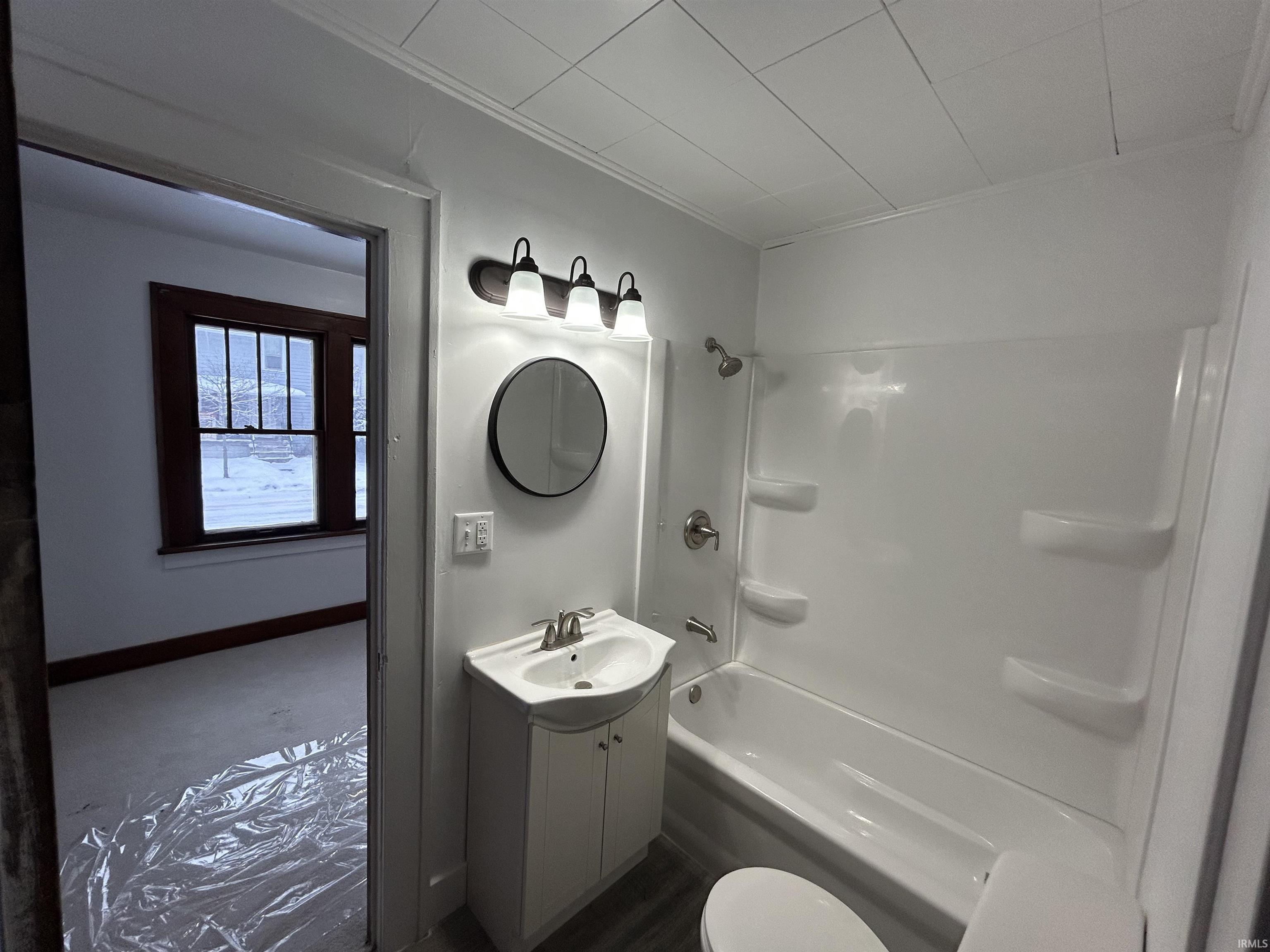 Full bath featuring vanity and bathtub / shower combination