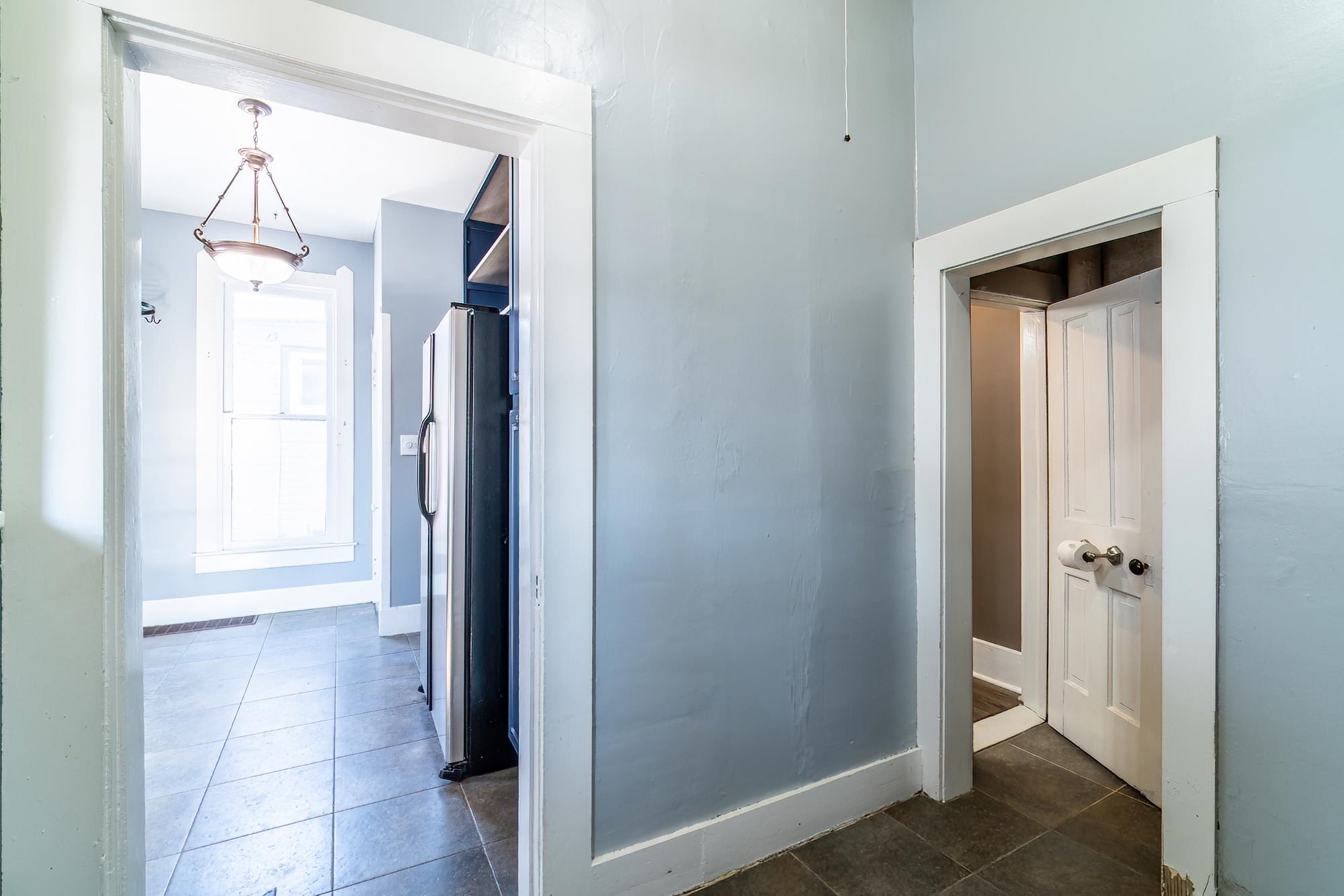 Laundry Room on main level with tile flooring.