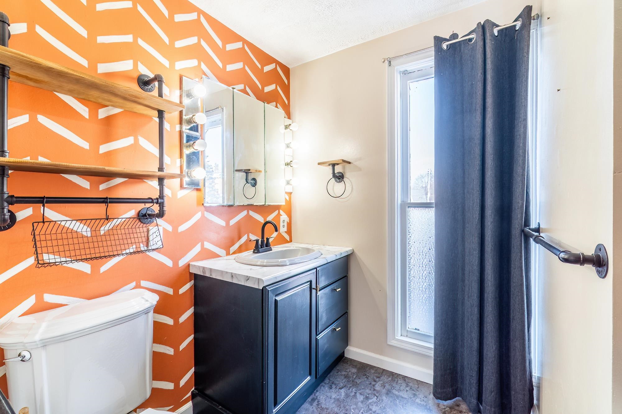 Full bath with vanity and bathtub / shower combination
