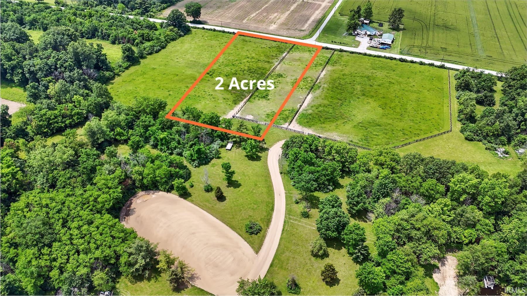 Overview of rural landscape featuring property boundaries highlighted and extensive farmland