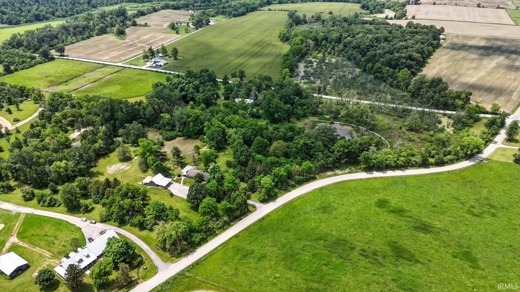 Overview of rural landscape with farmland and a tree filled landscape