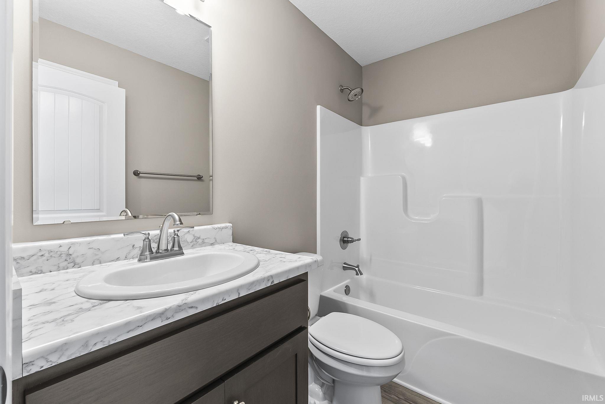Bathroom with vanity and tub / shower combination