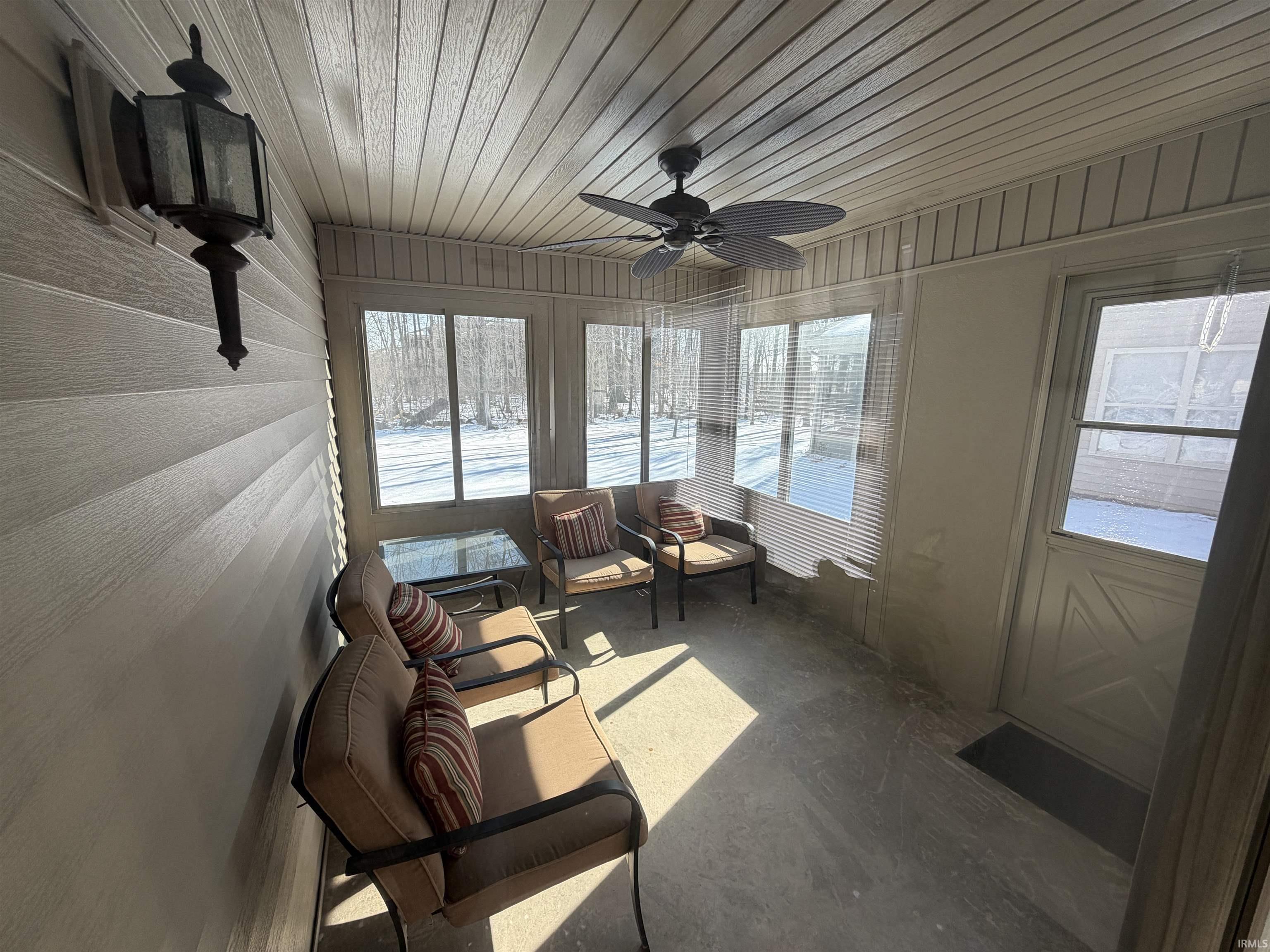Sunroom with a ceiling fan