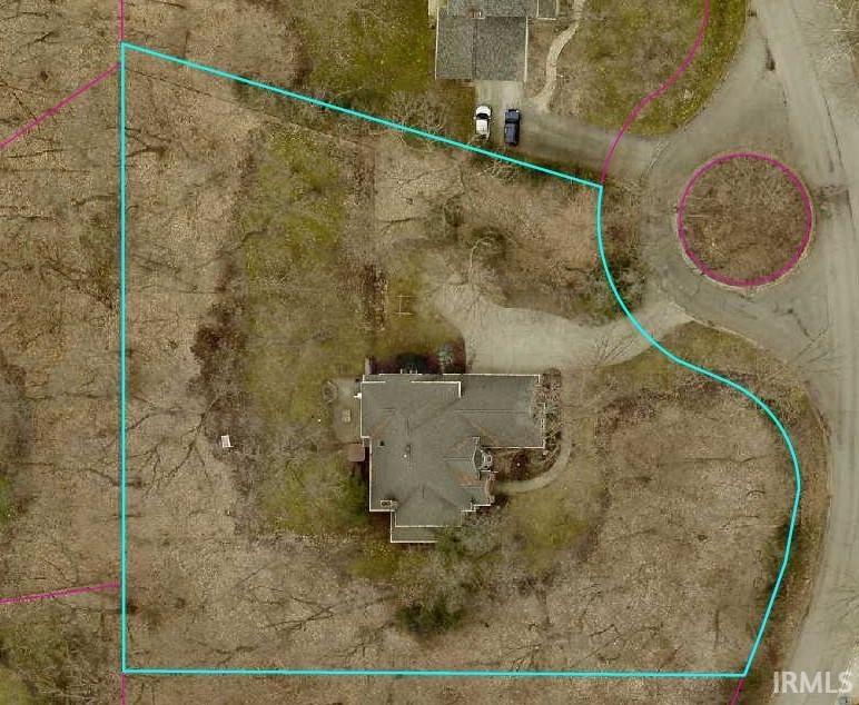 Aerial overview of property's location with property parcel outlined