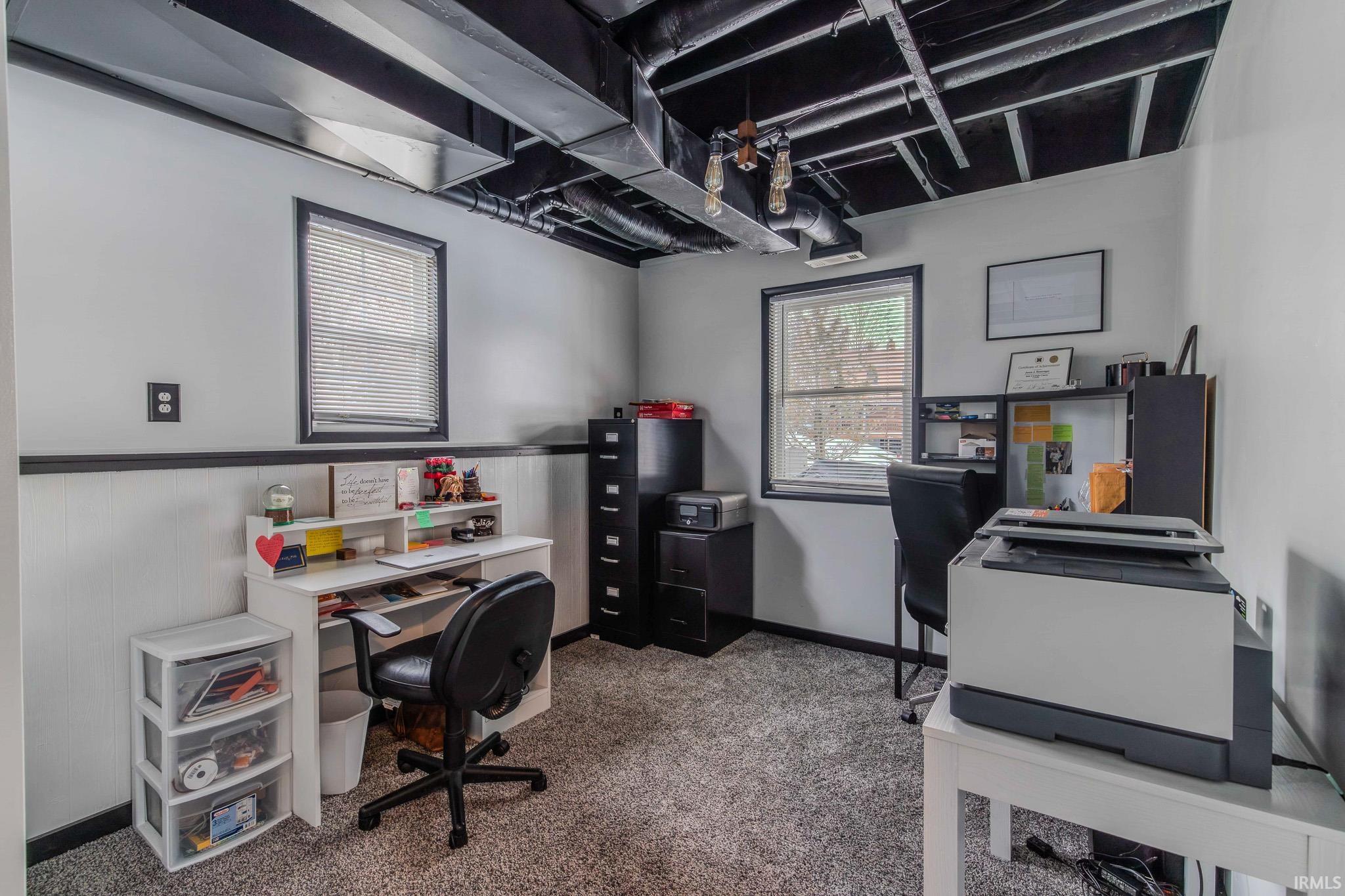 Office space featuring light colored carpet