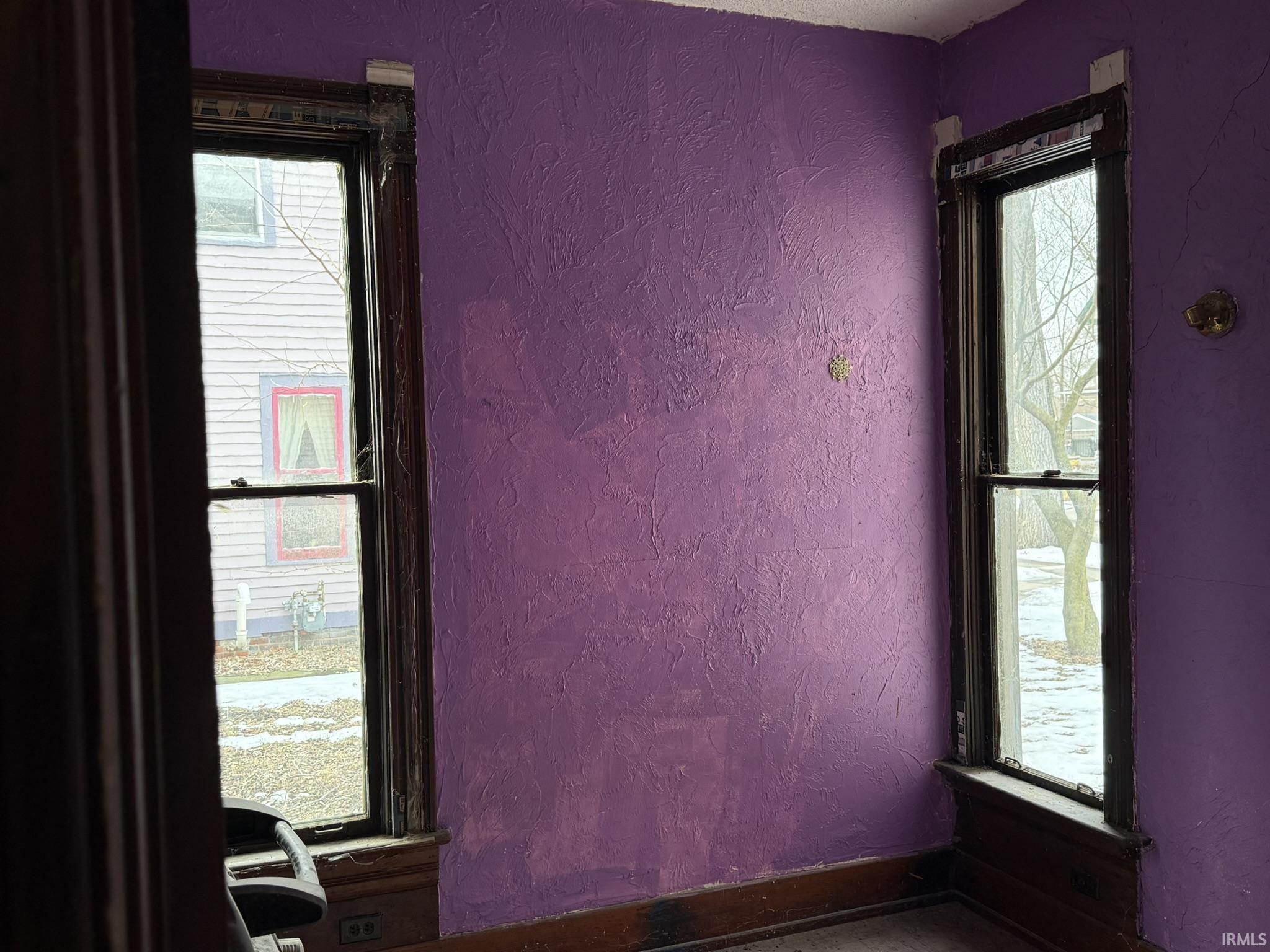 Unfurnished room with a textured wall