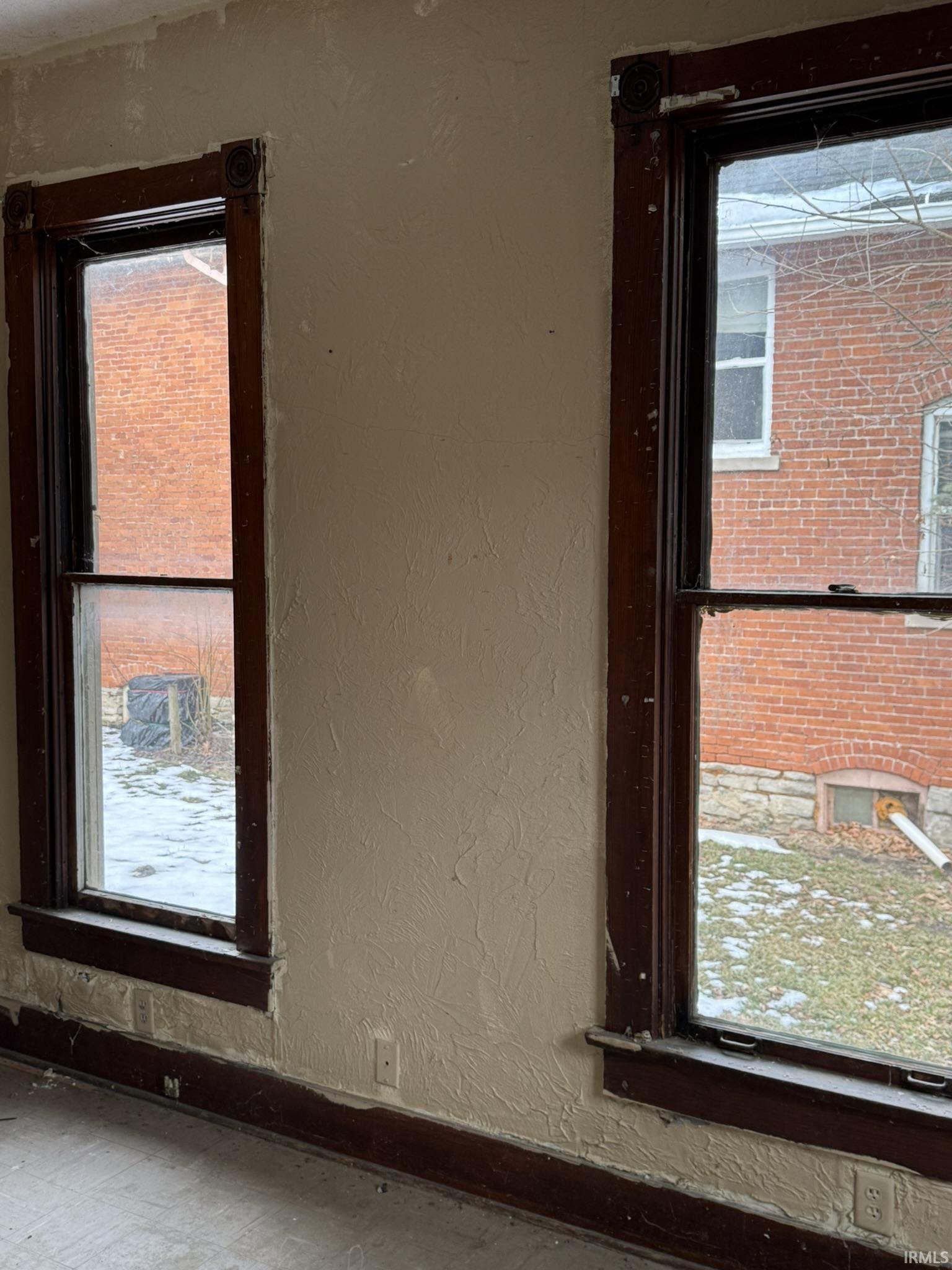 Detailed view of a textured wall and baseboards