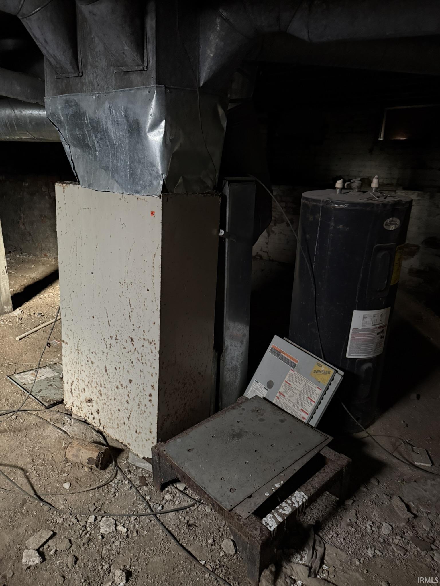 Utilities featuring heating unit and electric water heater