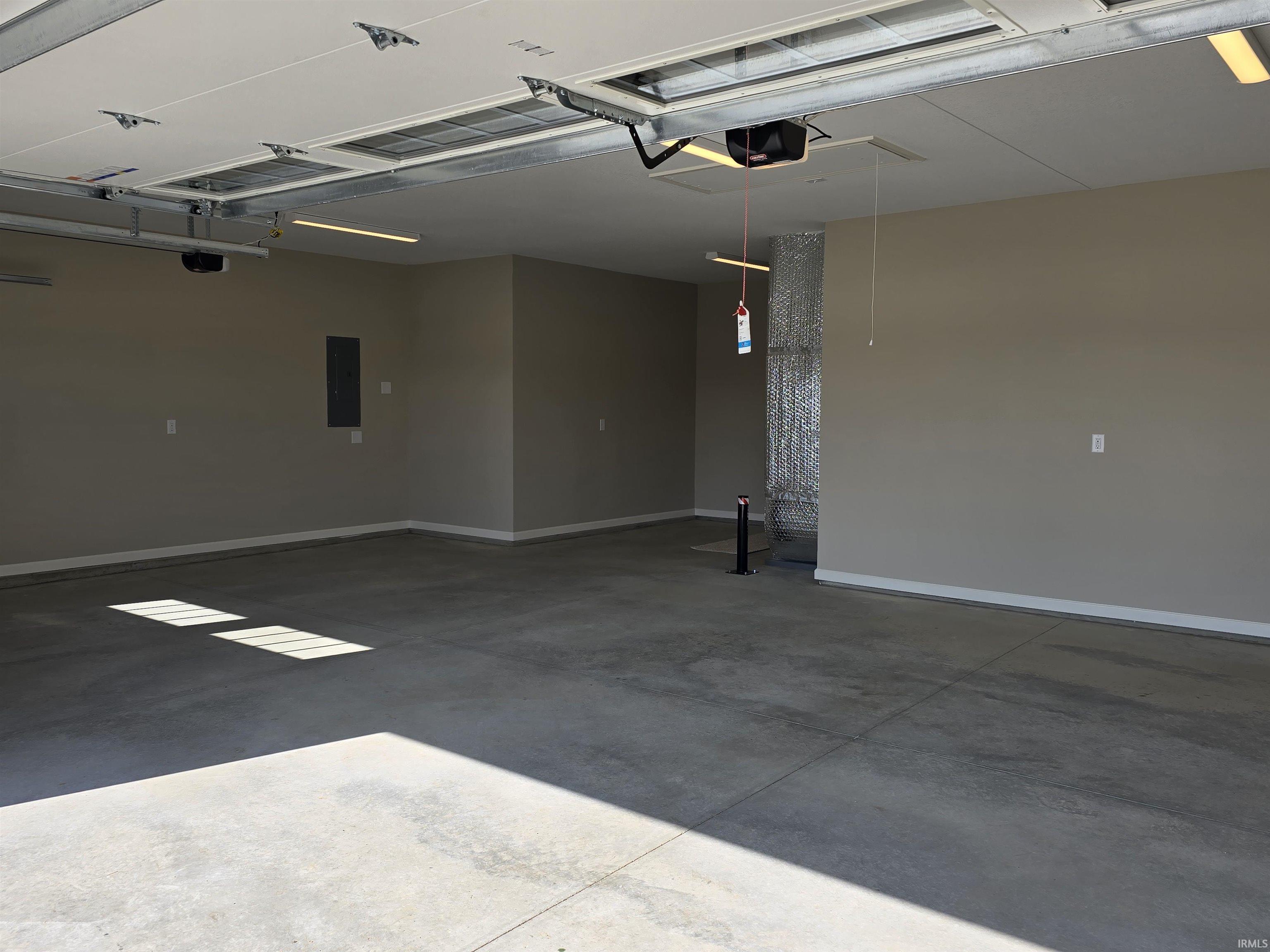 Notice the area to the back that offers great space off the main garage floor for a Refrigerator or freezer or both!