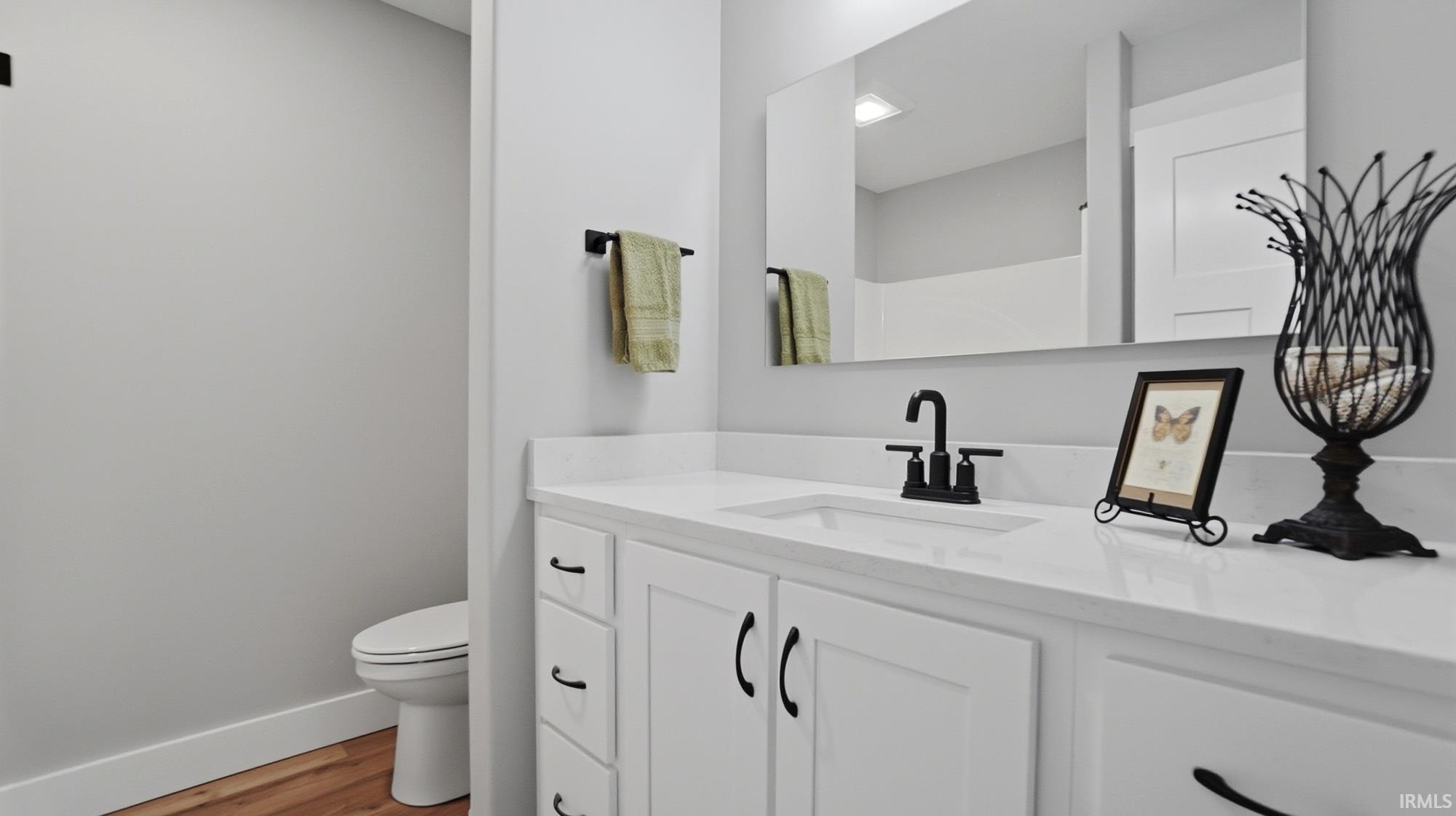 Bathroom with vanity and light wood-type flooring