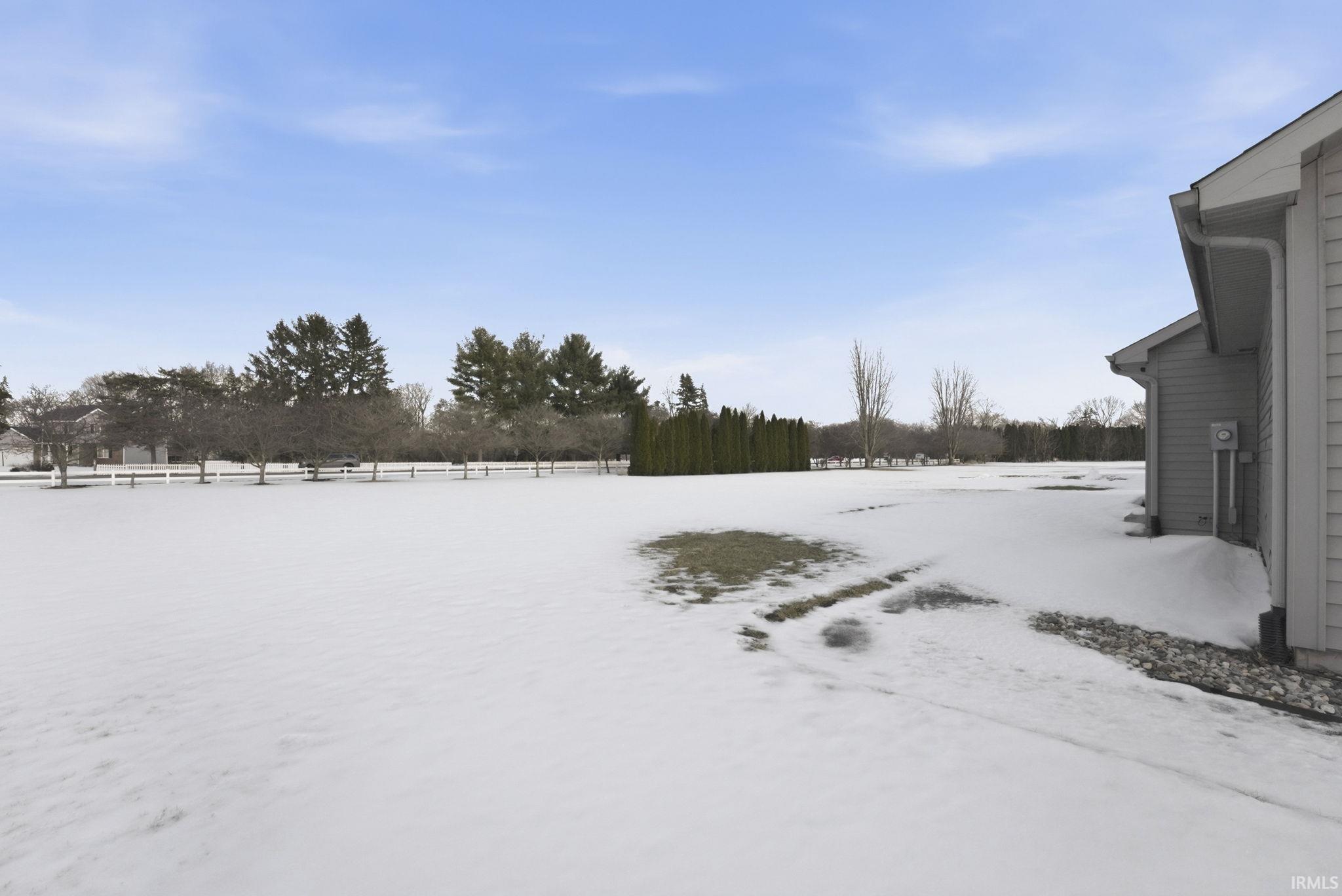 View of yard layered in snow
