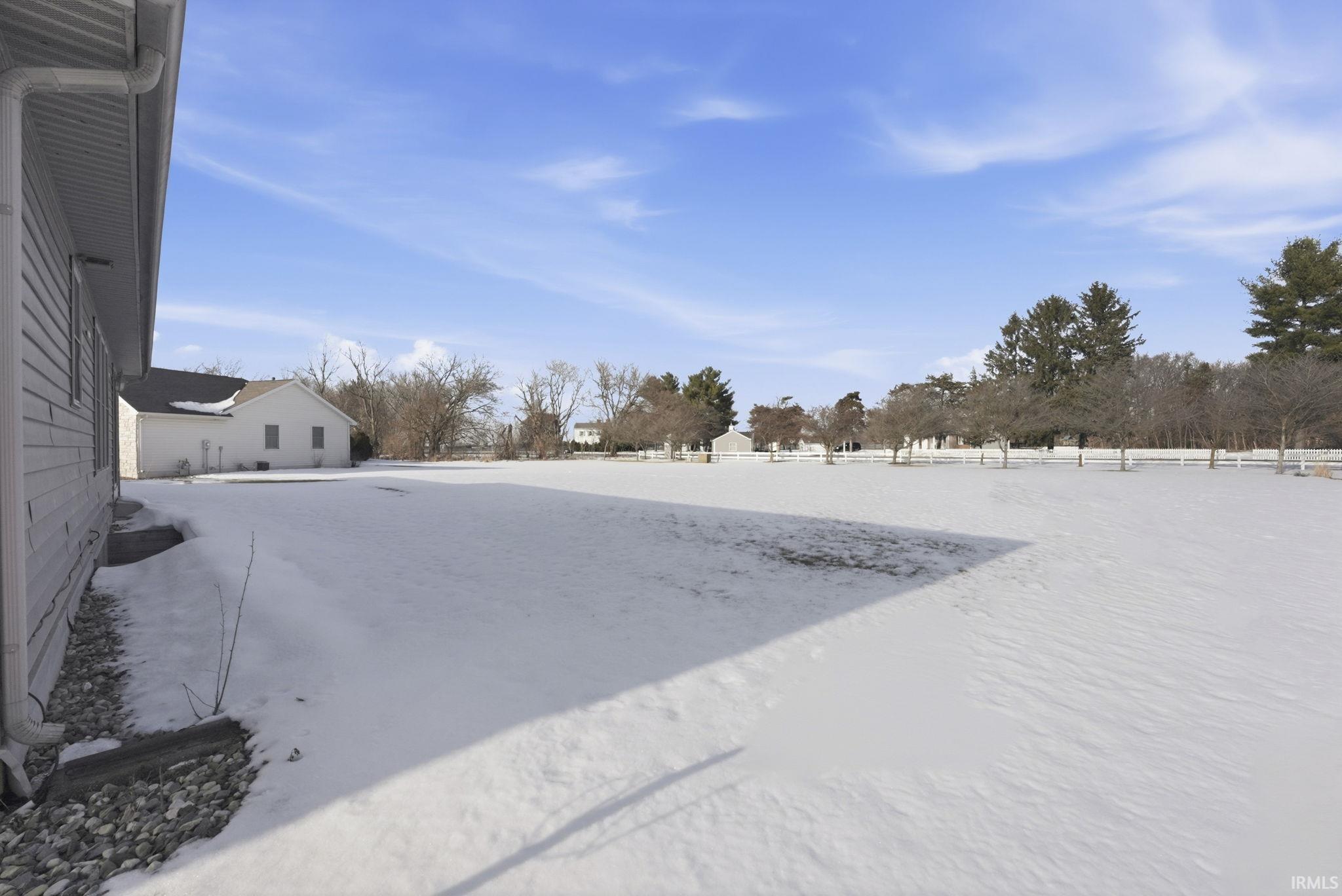 View of yard covered in snow