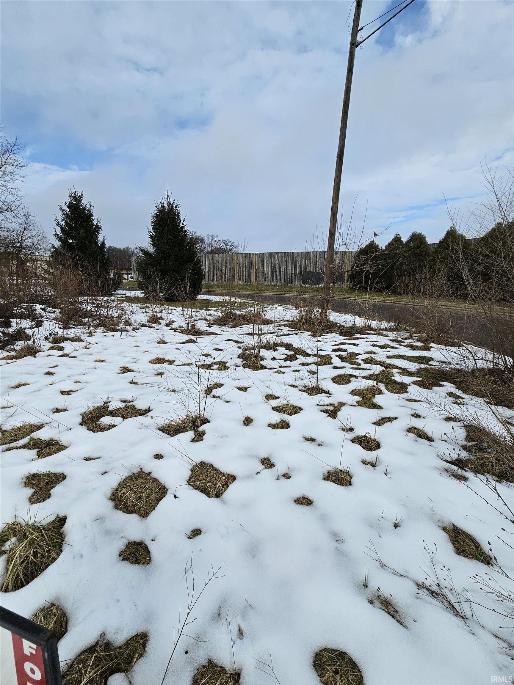 View of yard layered in snow