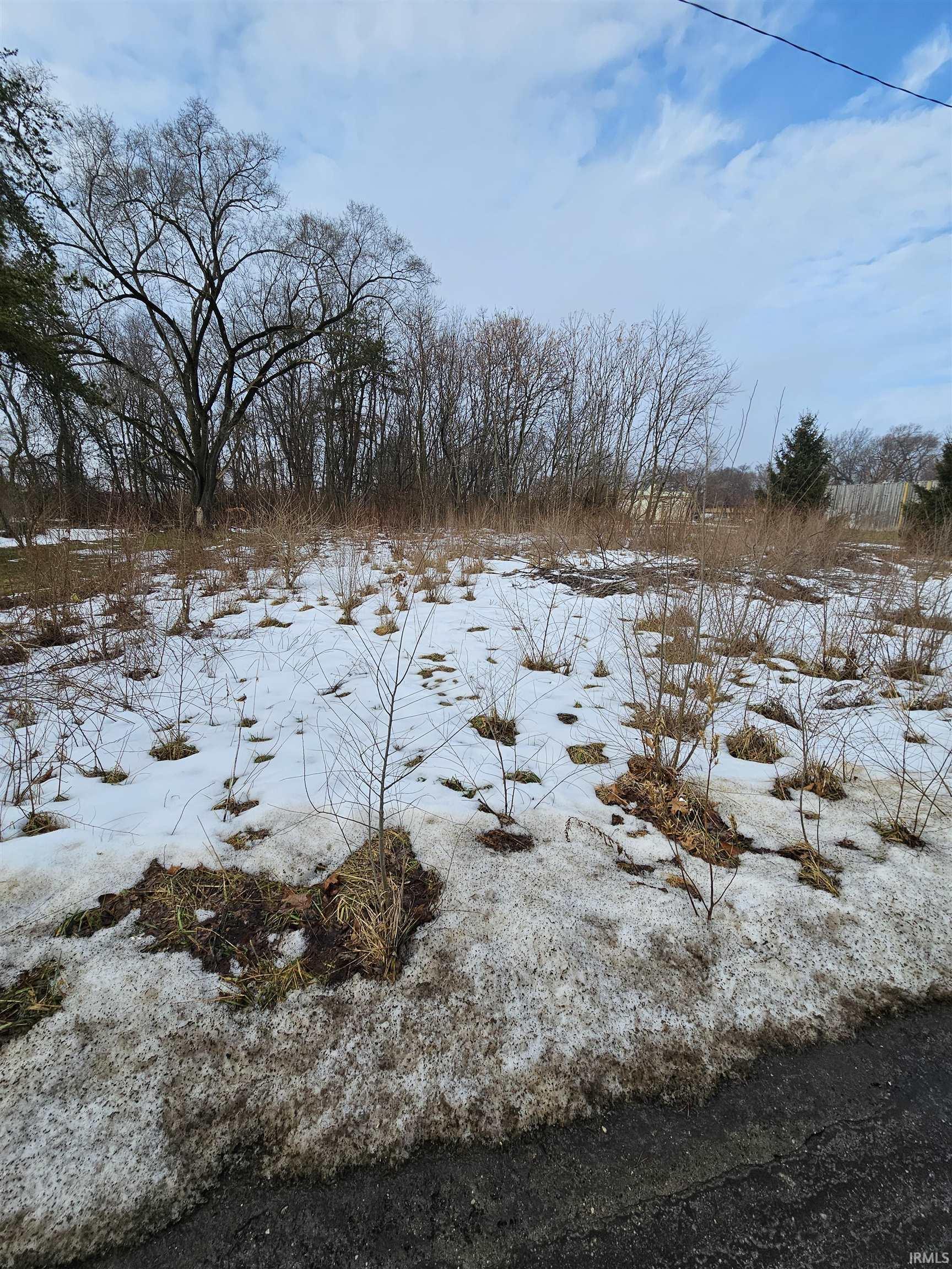 View of yard layered in snow