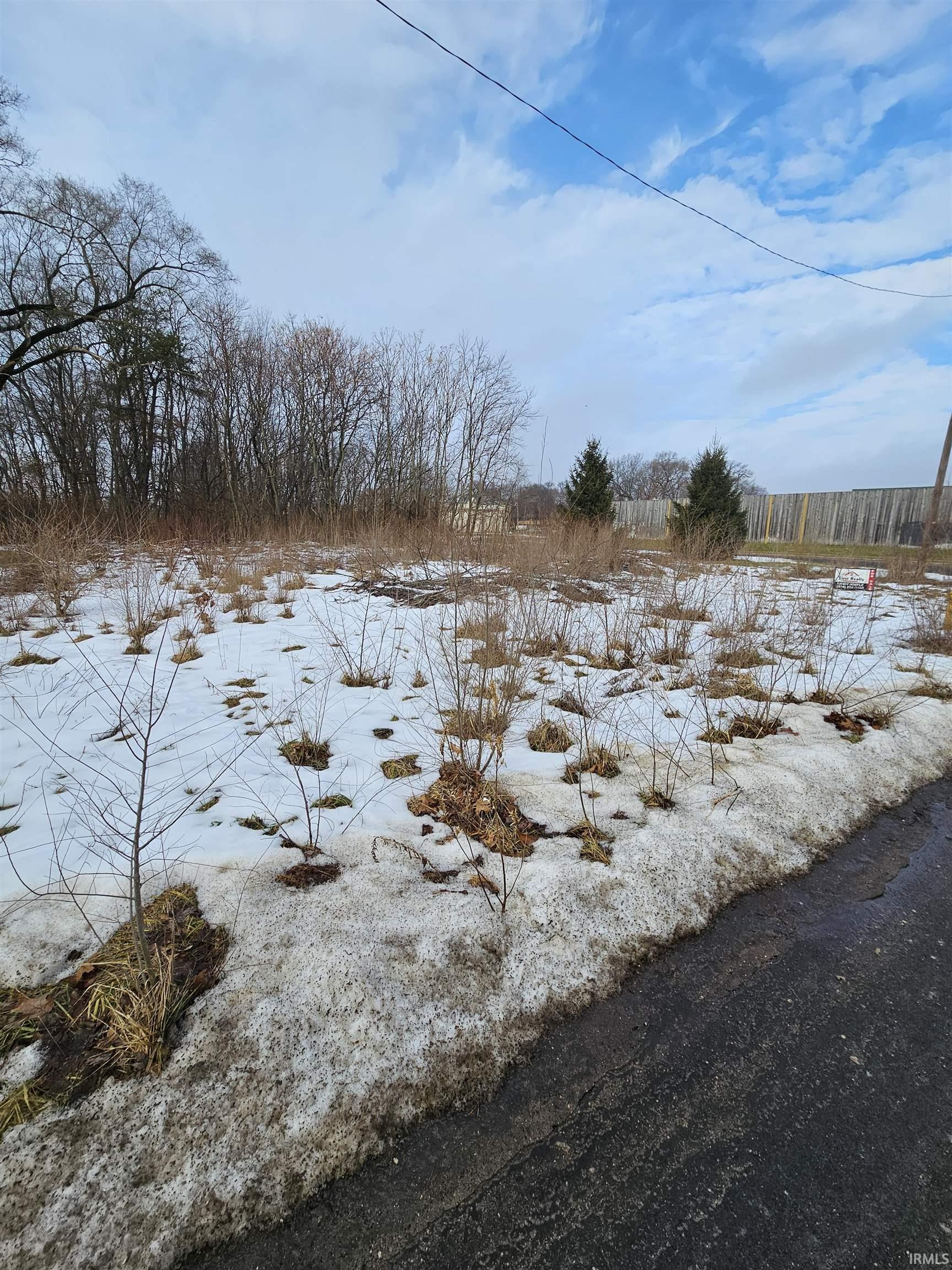 View of yard covered in snow