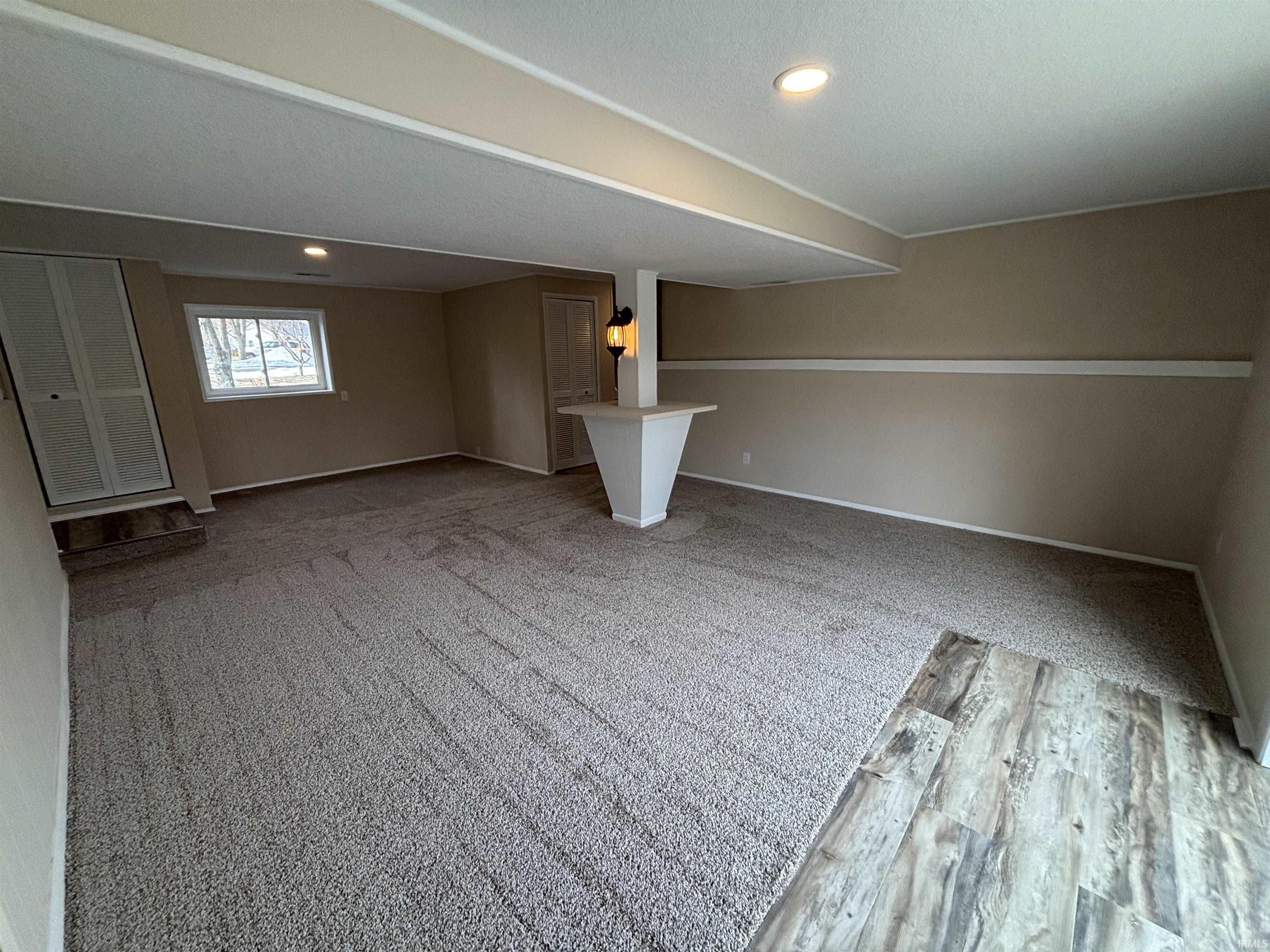 featuring wood finished floors and recessed lighting