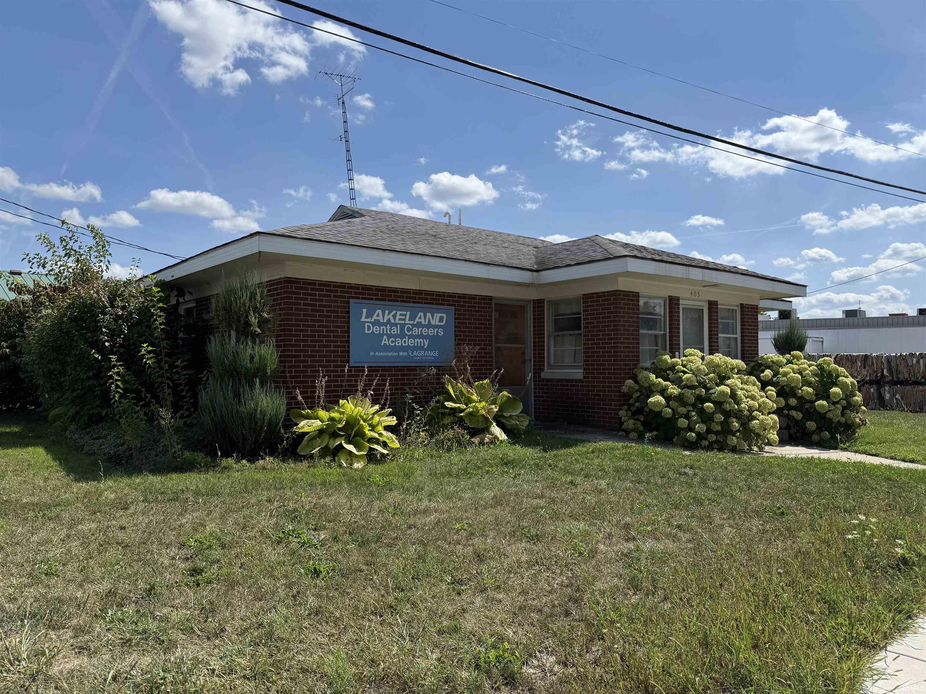 View of front of home featuring brick siding