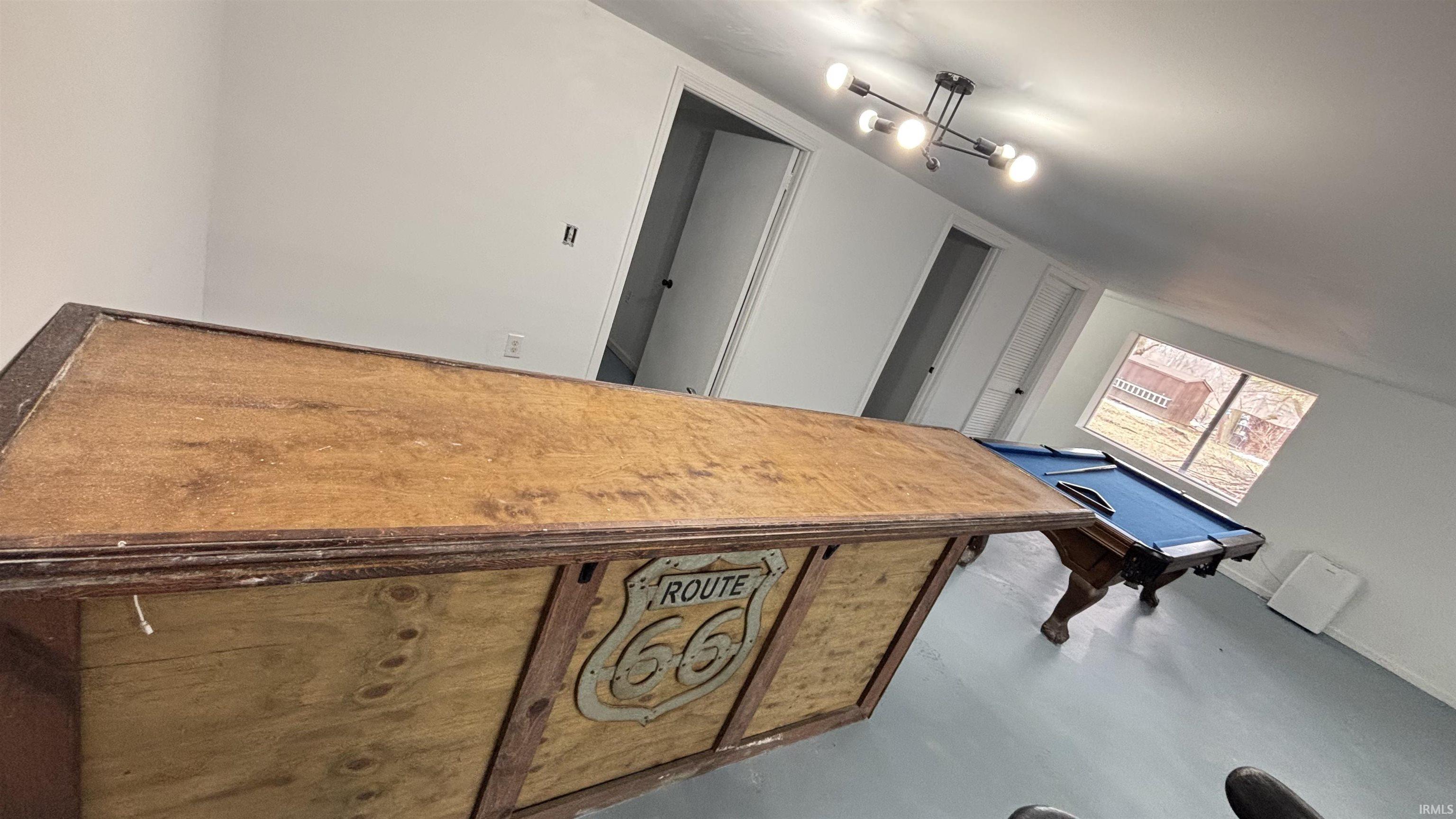 Dining room with concrete floors and pool table