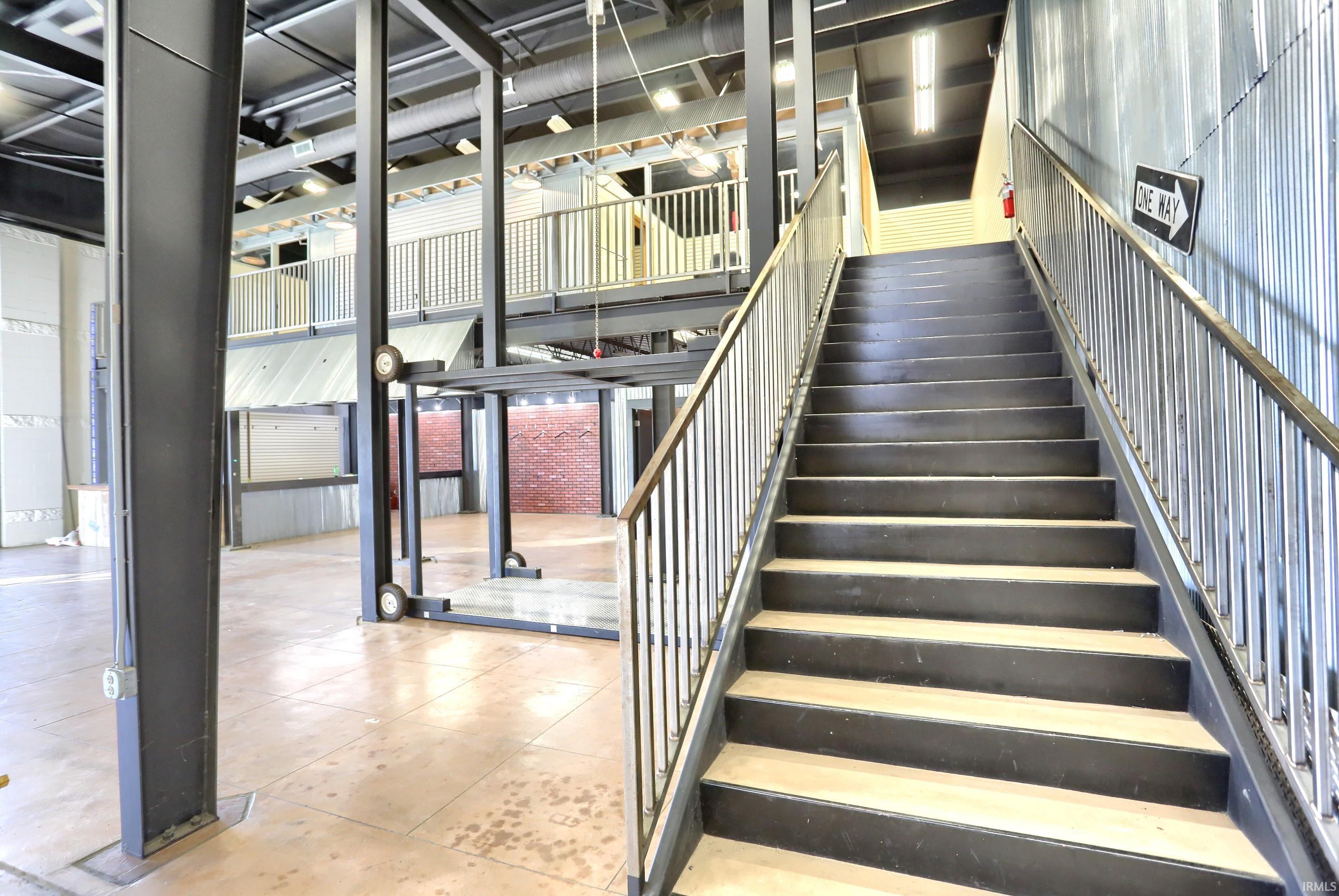 Staircase featuring tile patterned flooring