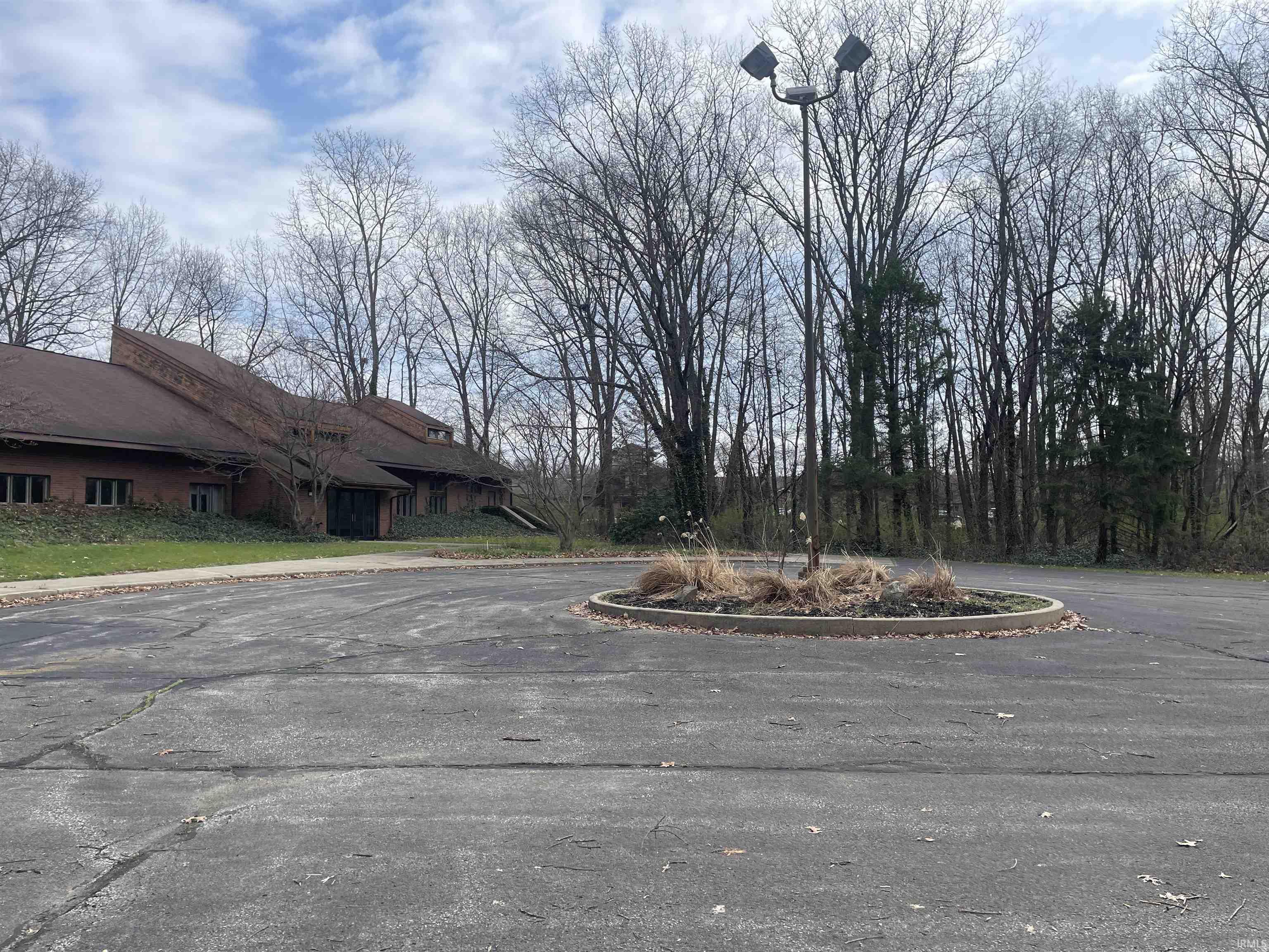 View of asphalt road featuring curbs