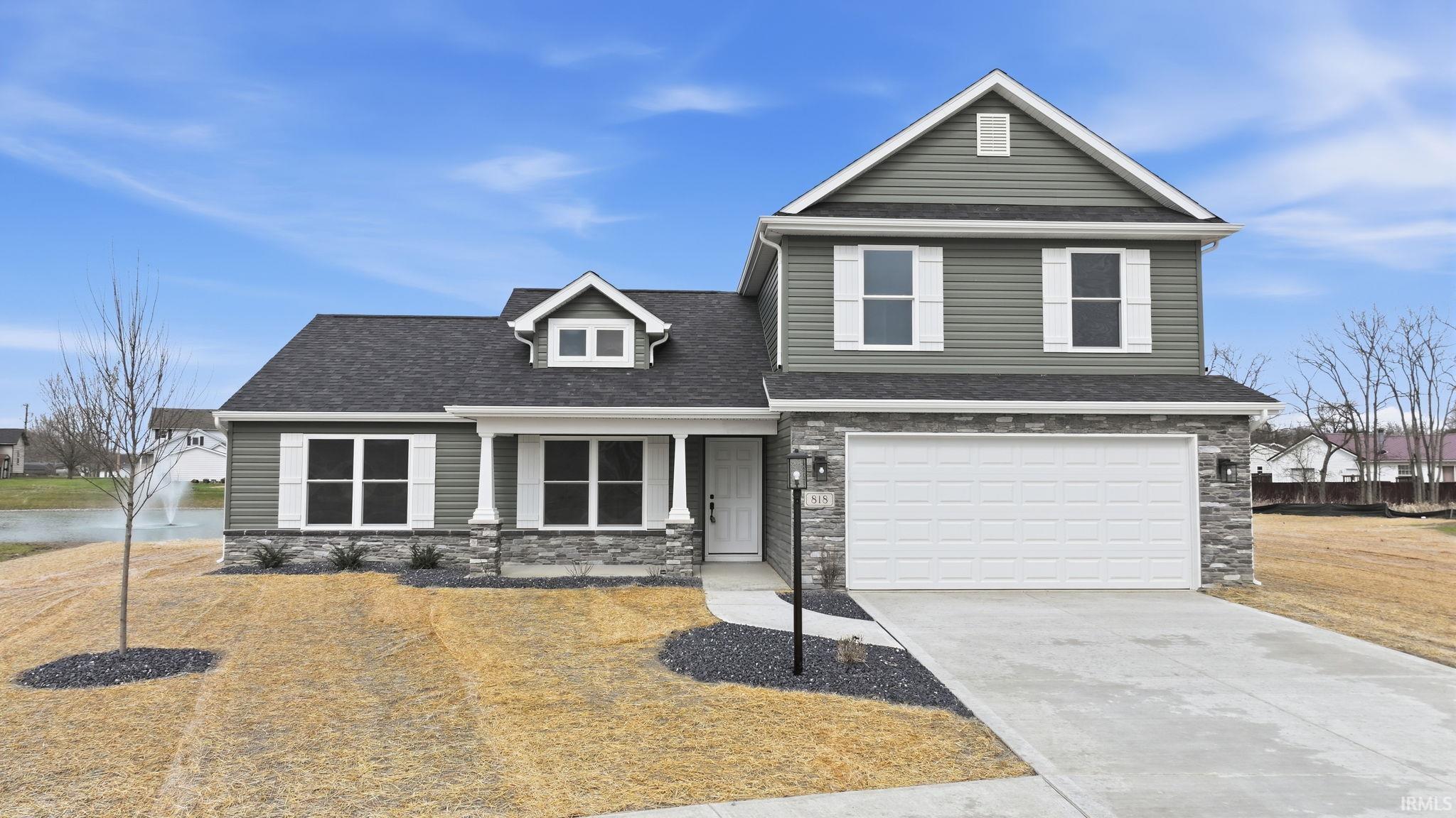 View of front of house featuring an attached garage, a porch, concrete driveway, stone siding, and a shingled roof