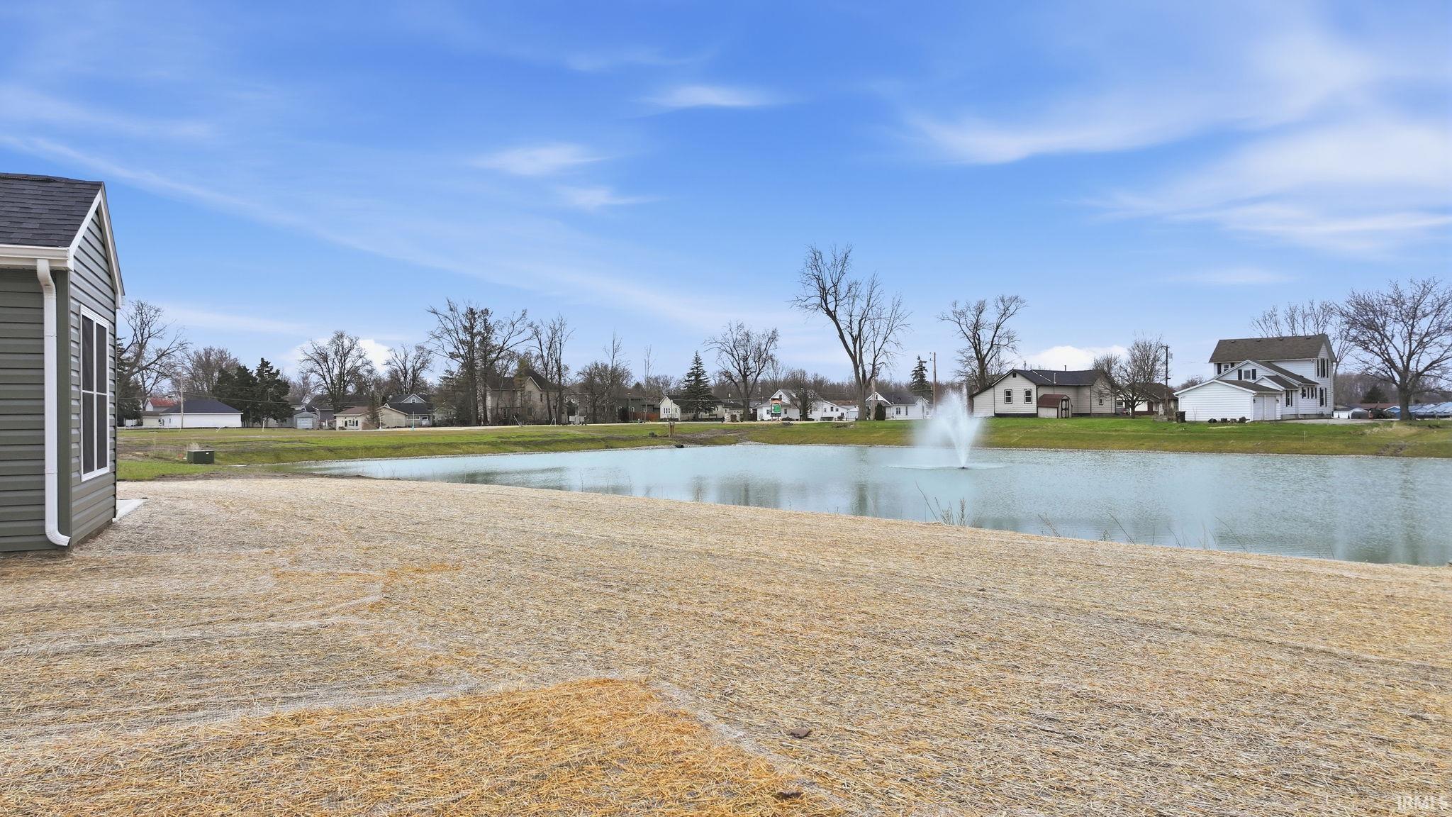 Water view featuring nearby suburban area