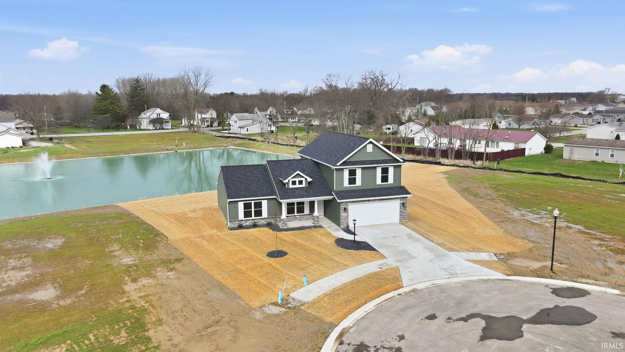 Aerial view of residential area with a large body of water