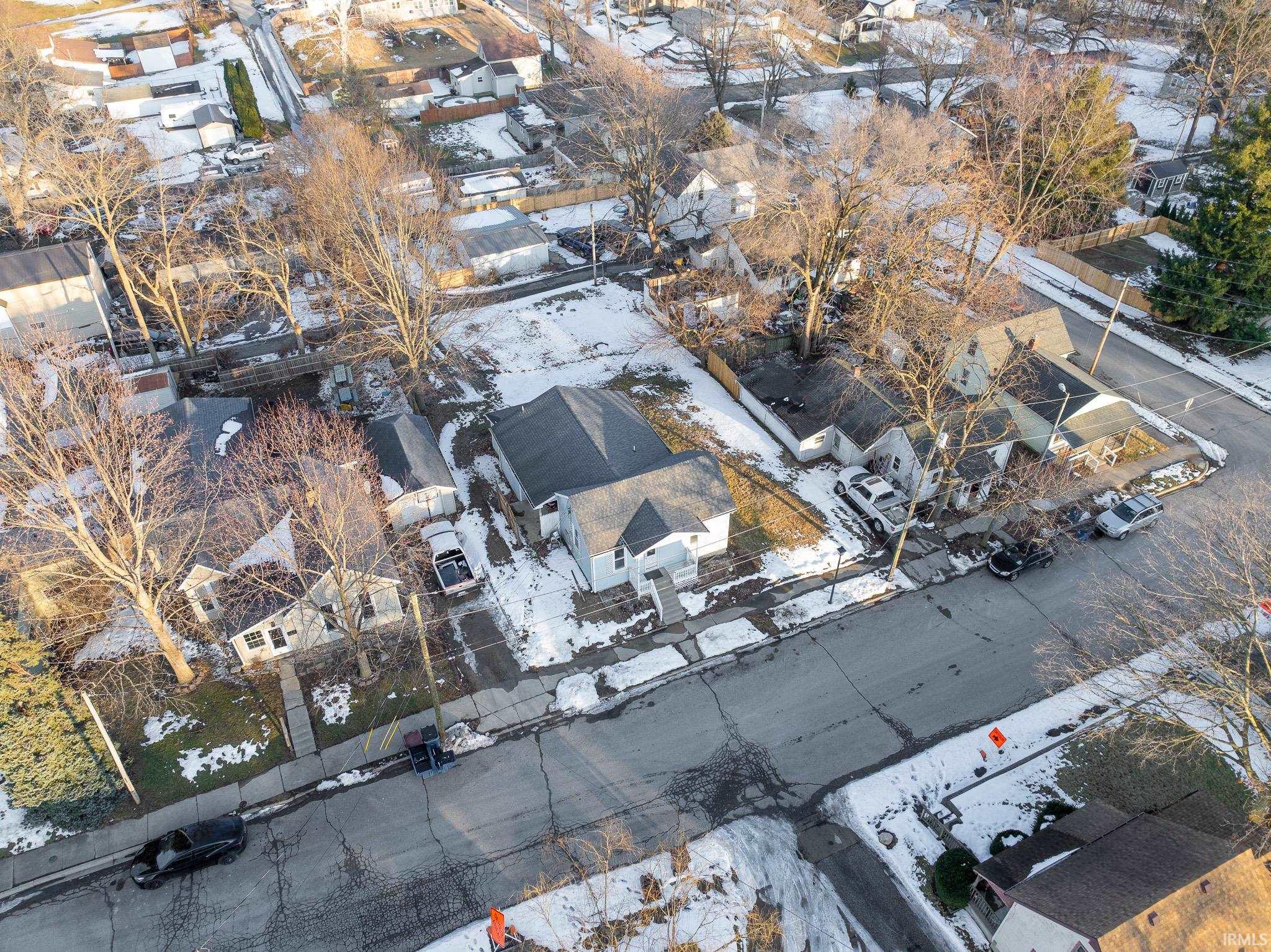 Snowy aerial view featuring a residential view