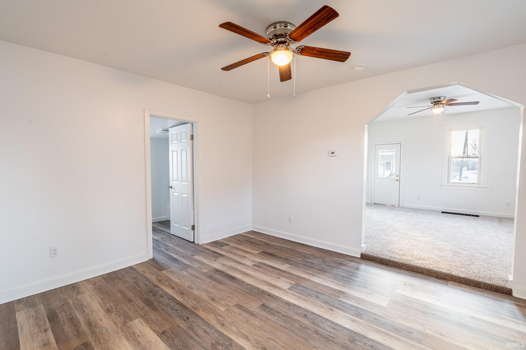 Spare room featuring ceiling fan and wood finished floors