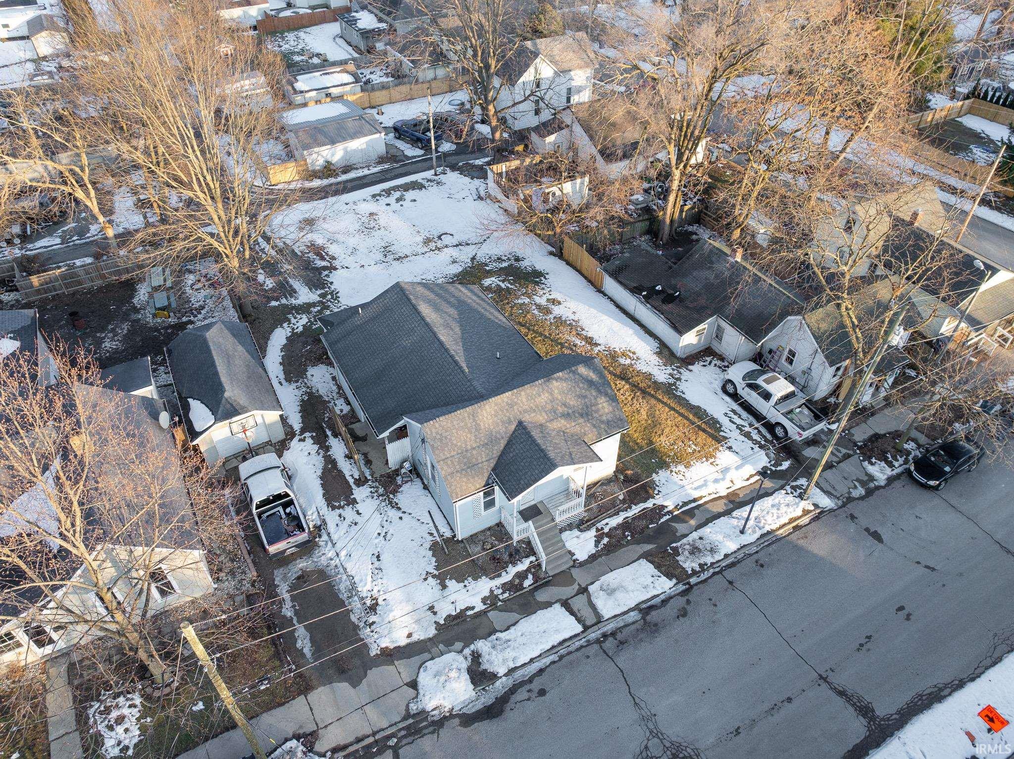 Snowy aerial view featuring a residential view